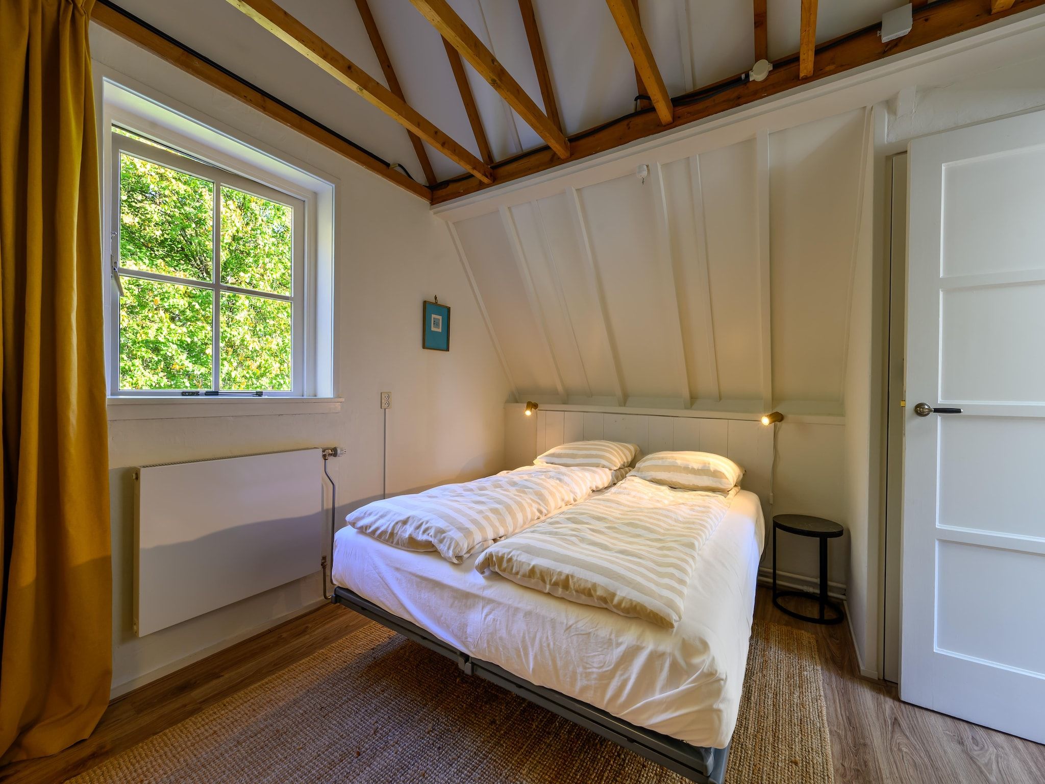 Een slaapkamer van Vakantiehuis Fijn in Bergen