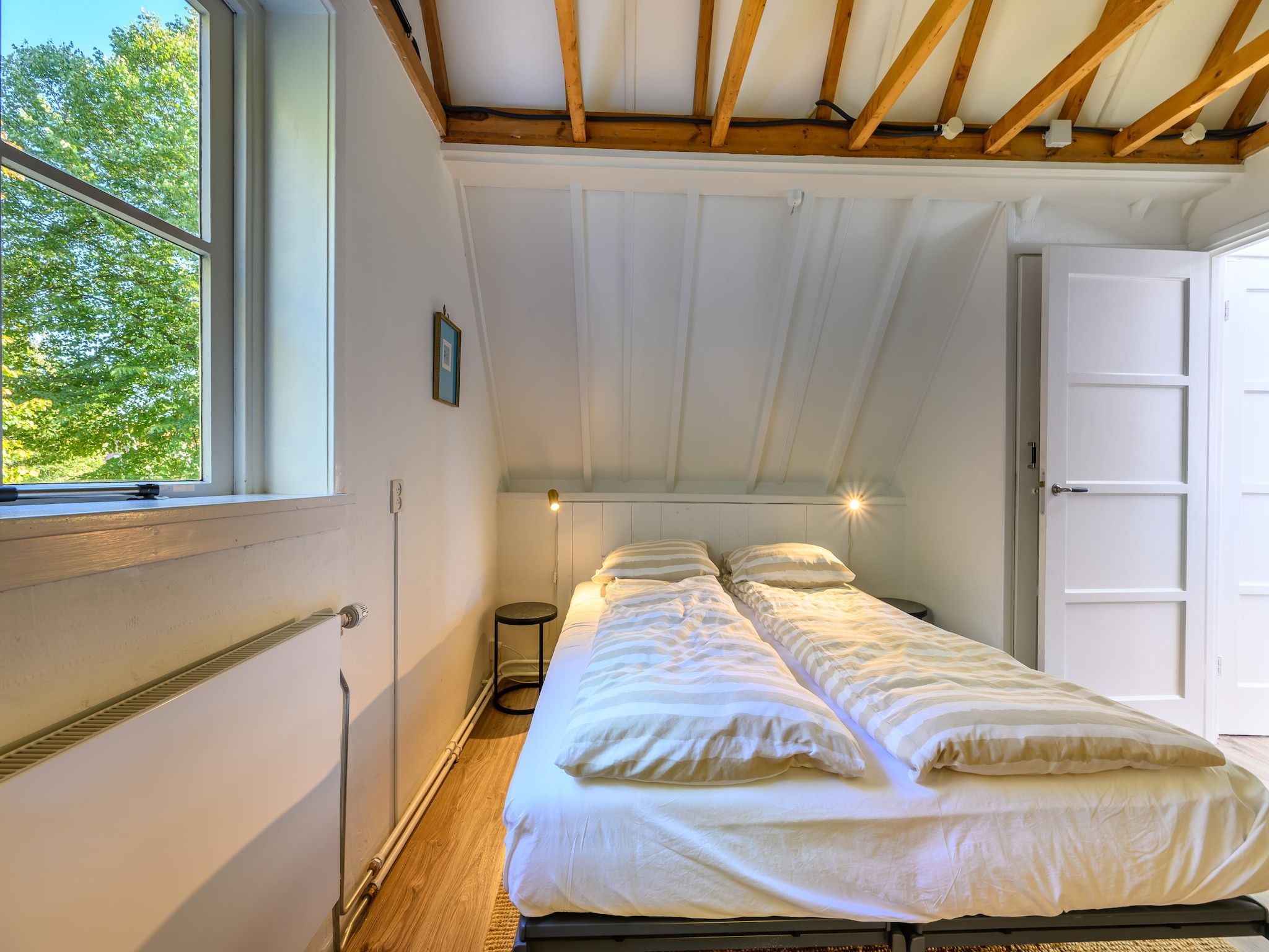 Een slaapkamer van Vakantiehuis Fijn in Bergen