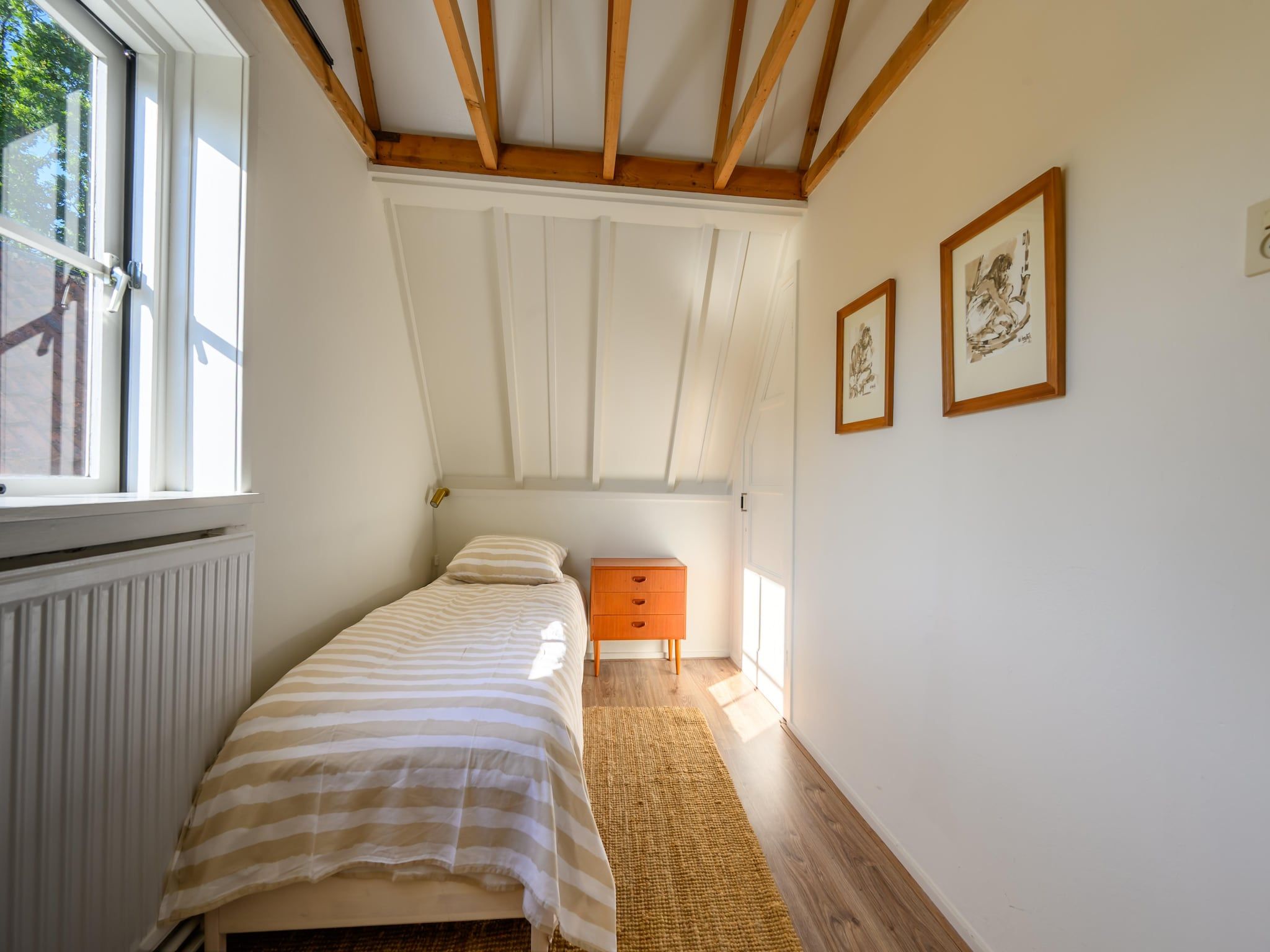 Een slaapkamer van Vakantiehuis Fijn in Bergen