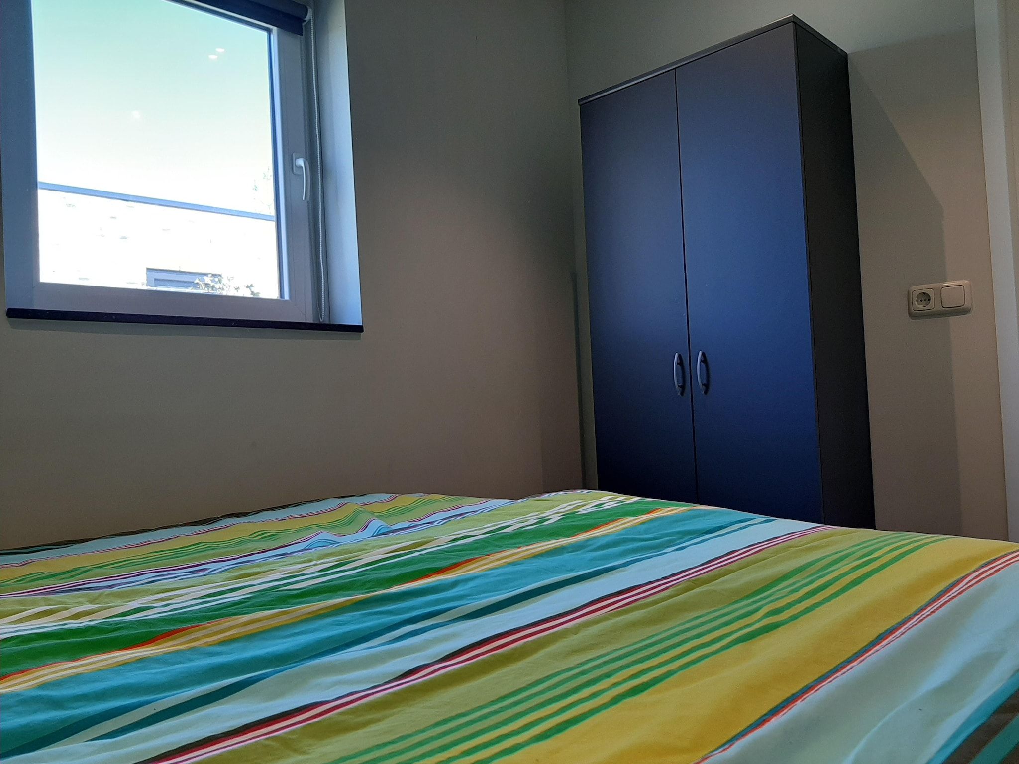 Een slaapkamer van Kustwoning Baarland in Zeeland in Baarland