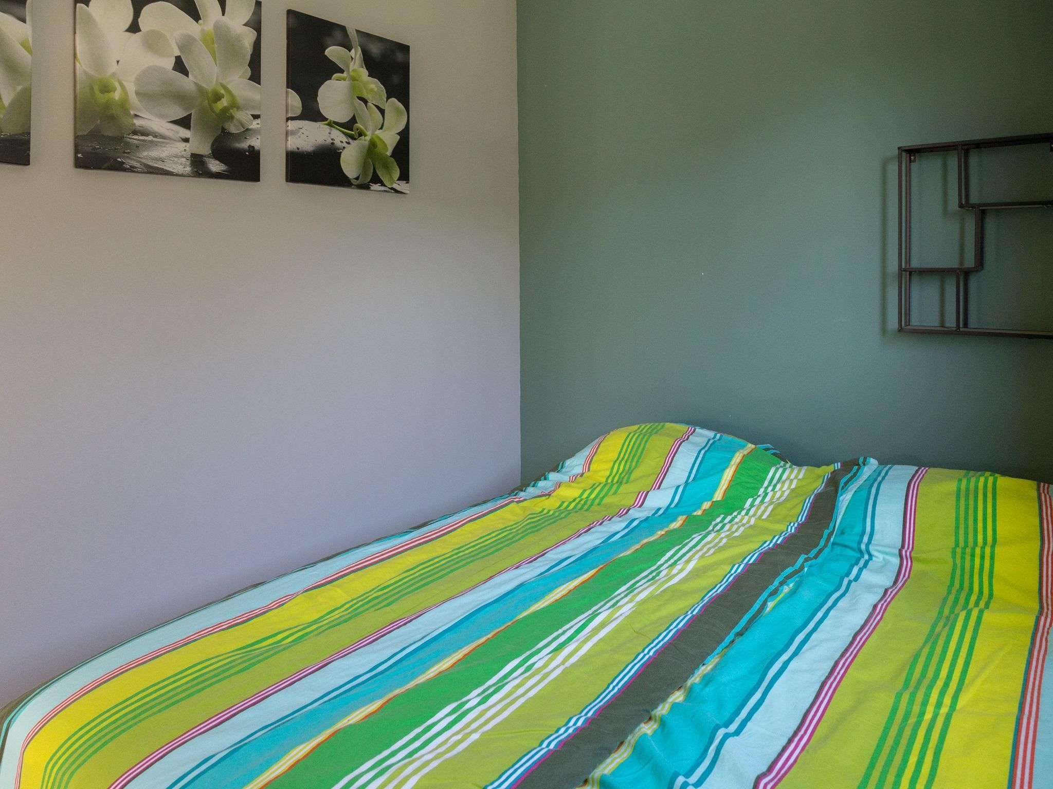 Een slaapkamer van Kustwoning Baarland in Zeeland in Baarland