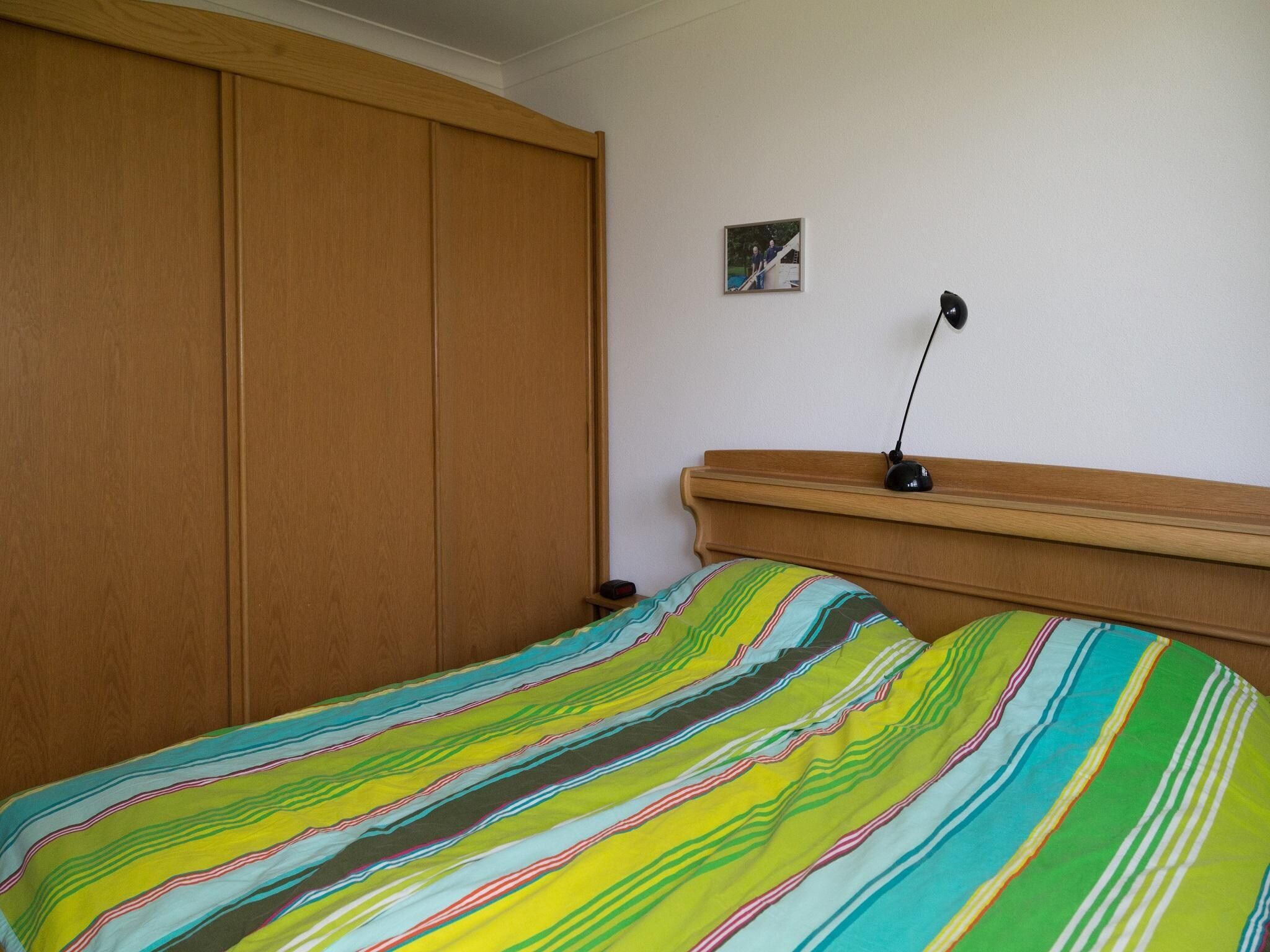 Een slaapkamer van Kustwoning Baarland in Zeeland in Baarland