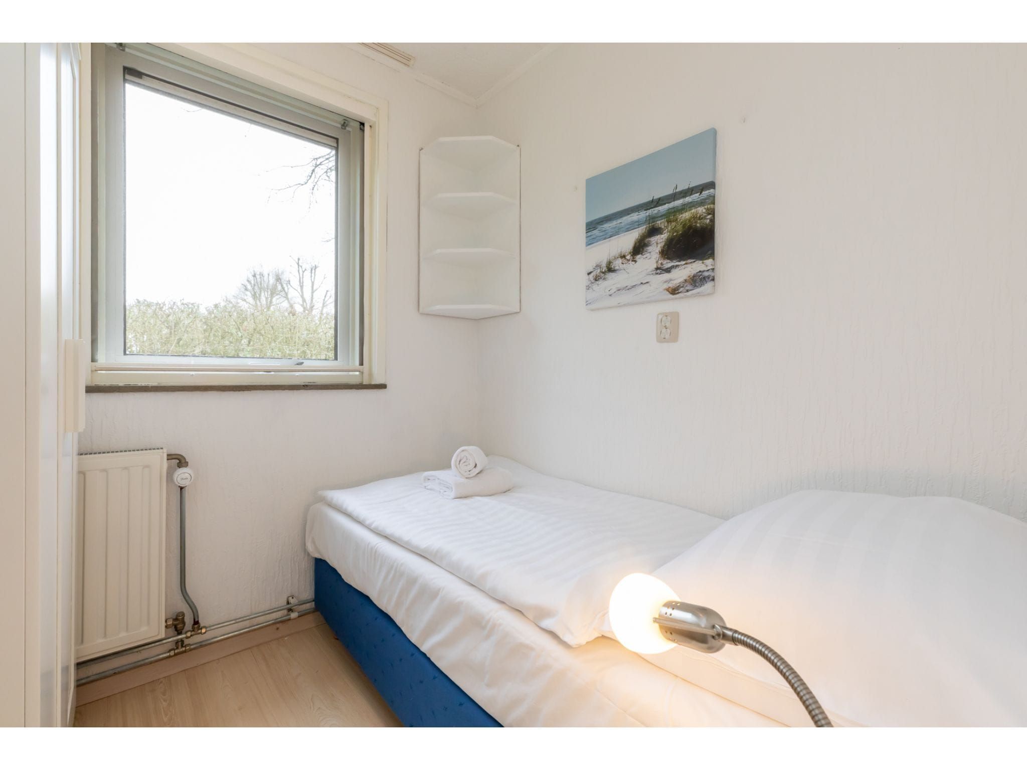 Een slaapkamer van Koekoesbloemwei 90 in Kortgene