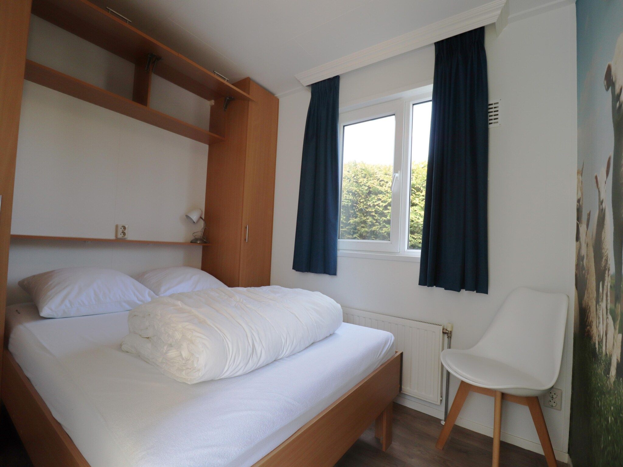 Een slaapkamer van De Lanterfanter in Grou