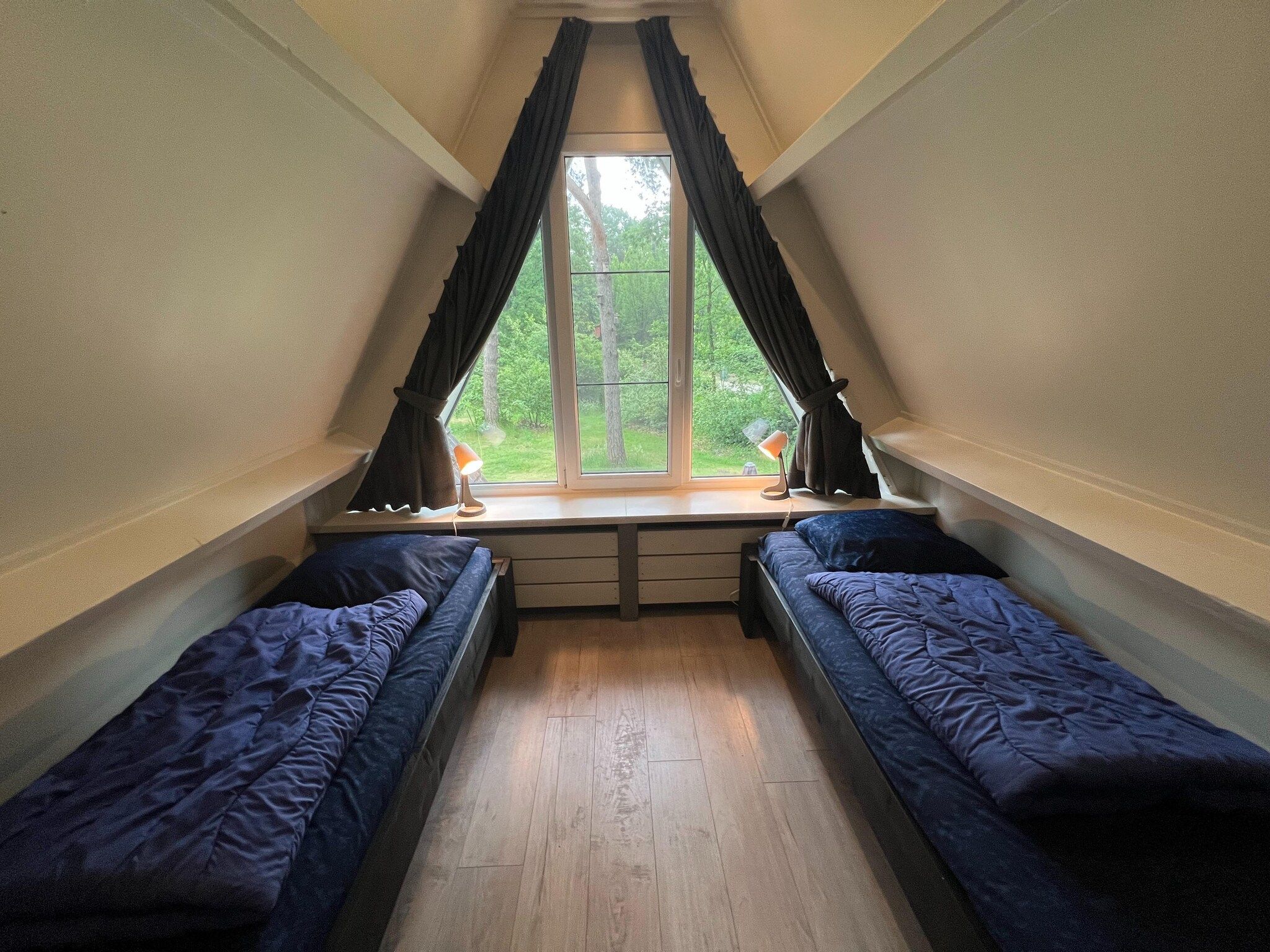 Een slaapkamer van Combi bungalow Vosseven 84 & 85 in Stramproy