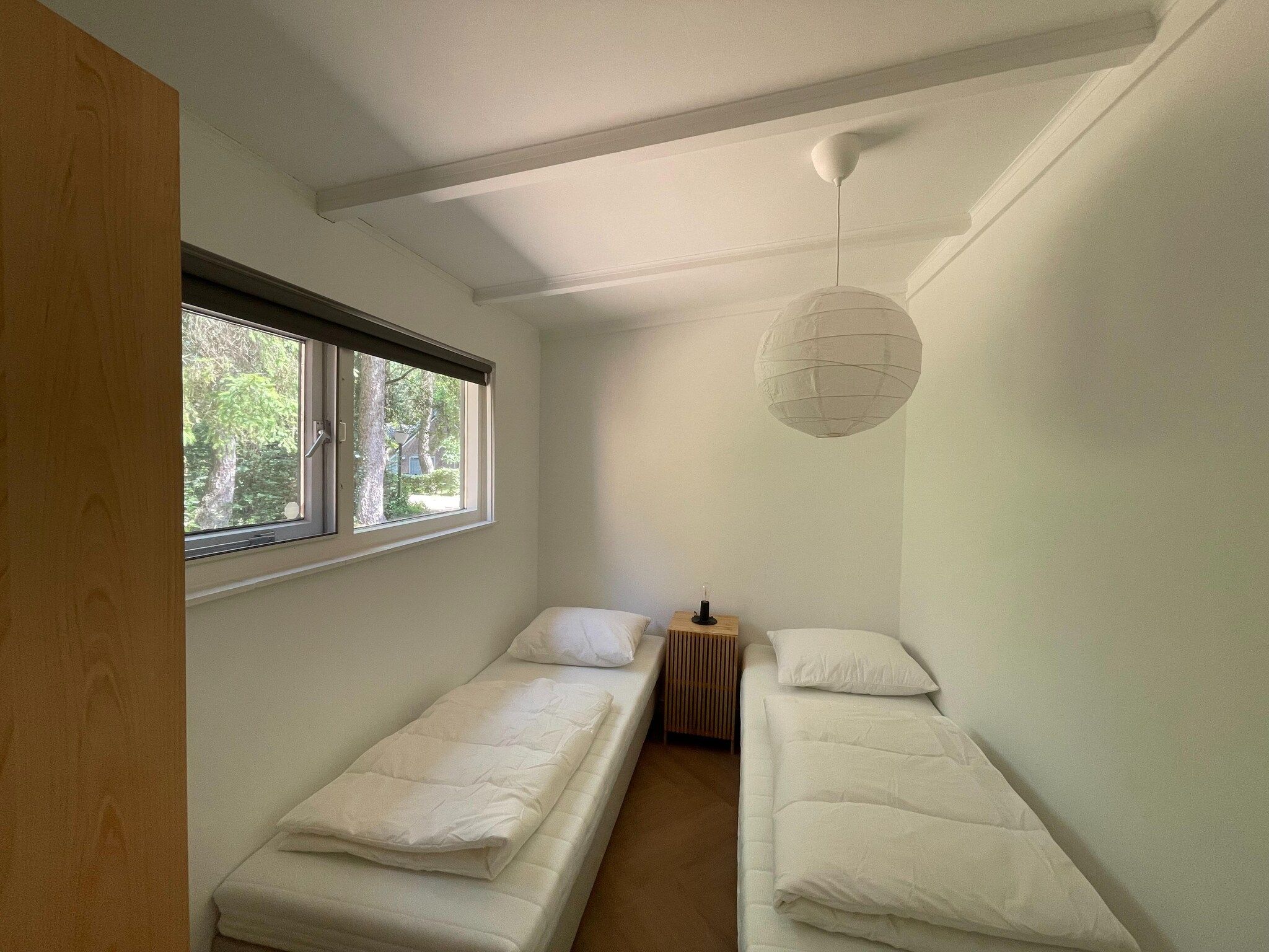 Een slaapkamer van Bos suite in Zelhem