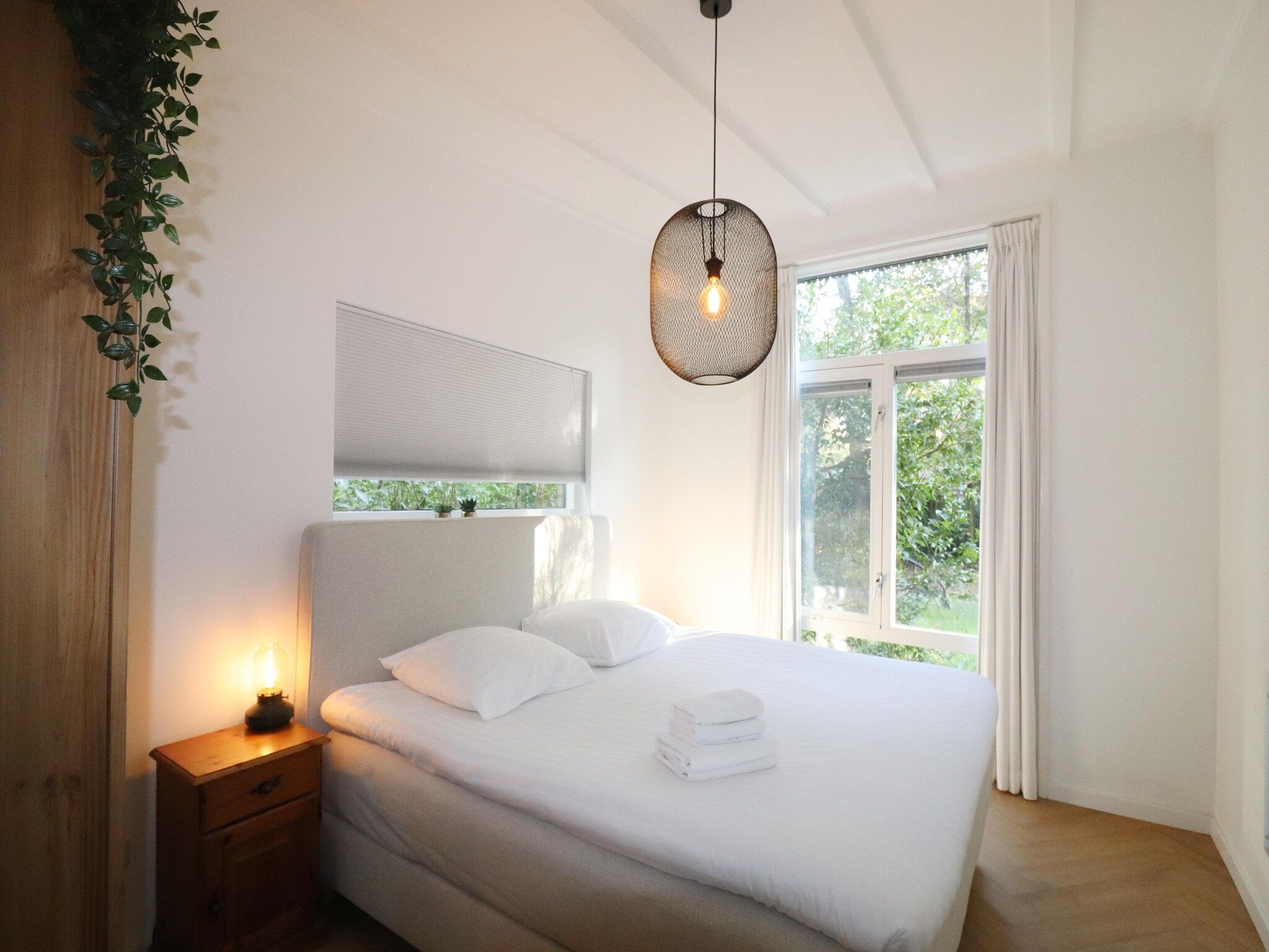 Een slaapkamer van Bos suite in Zelhem