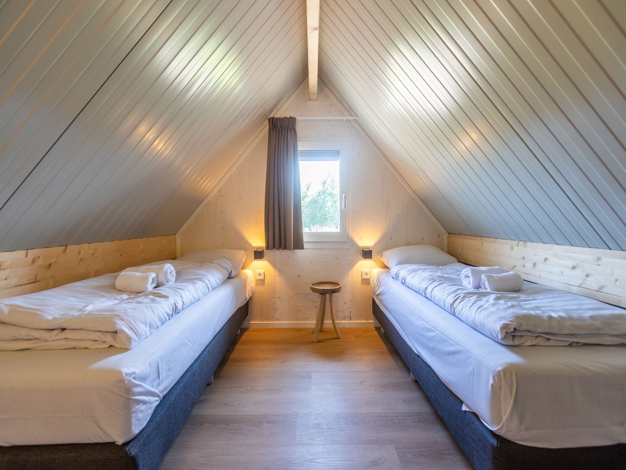 Een slaapkamer van Duinvilla 8 in Cadzand