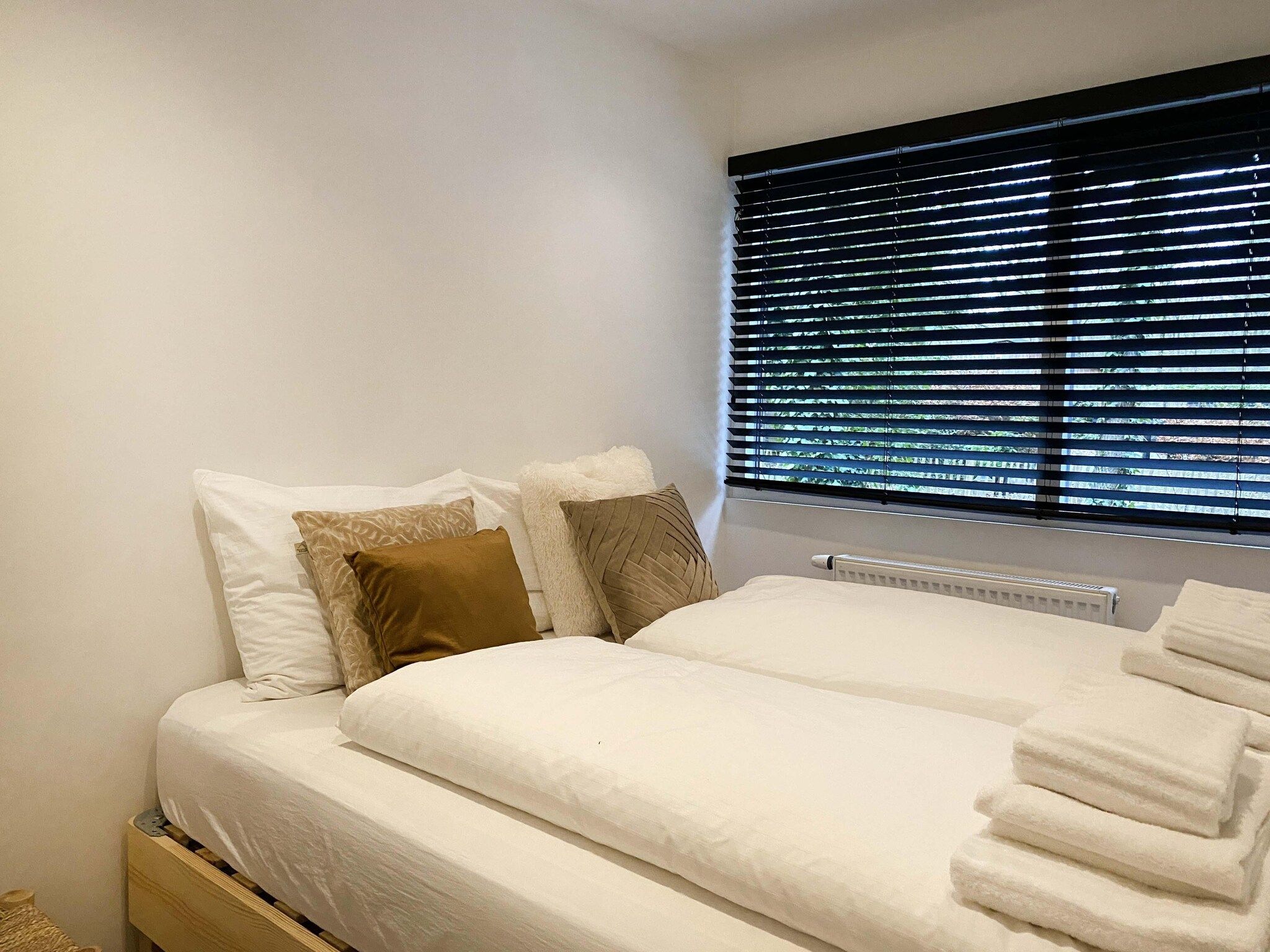 Een slaapkamer van Dutch Cabin Houses 45 in Rheezerveen