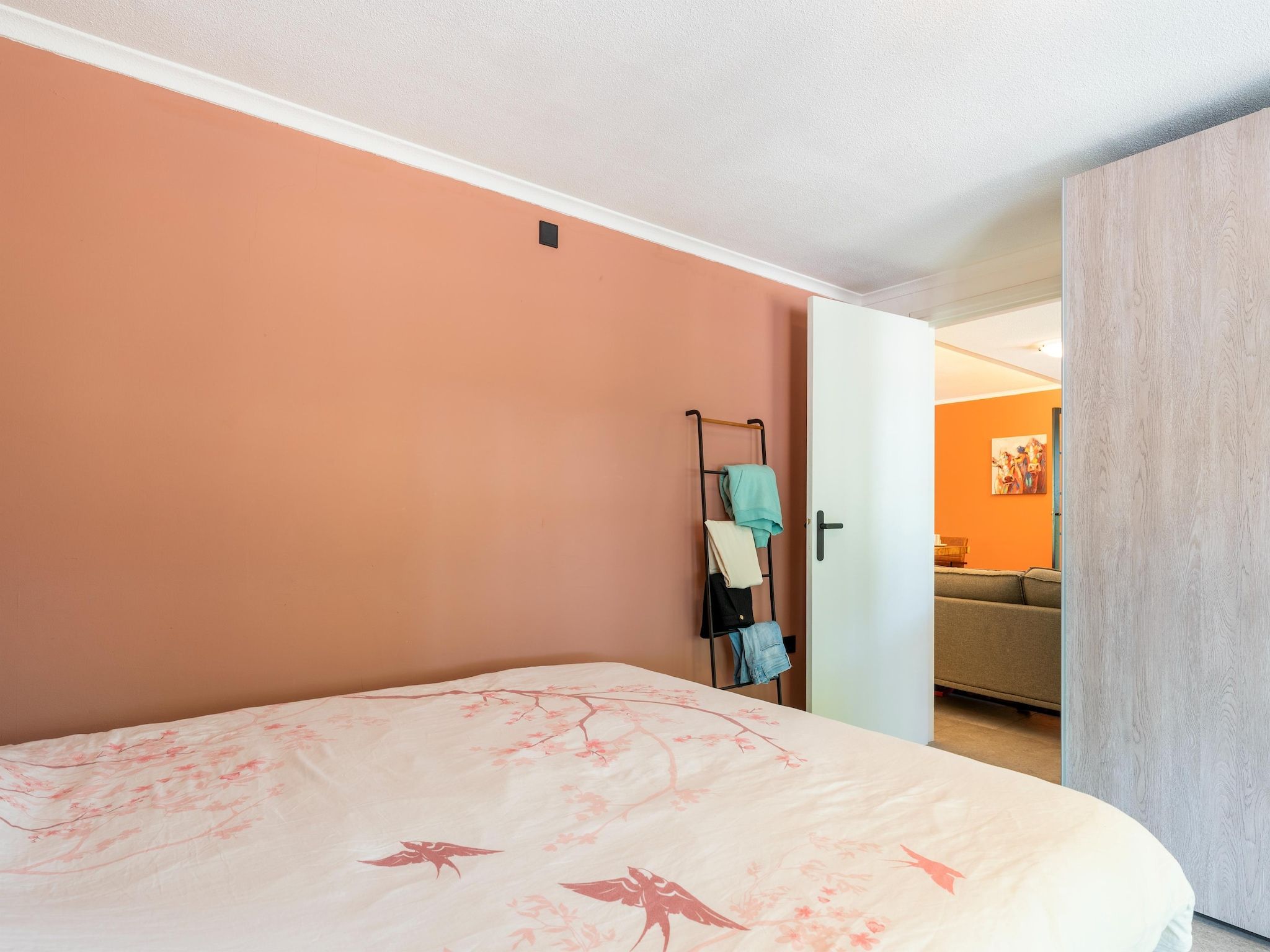 Een slaapkamer van Vakantiewoning de Zwaluw in Eibergen