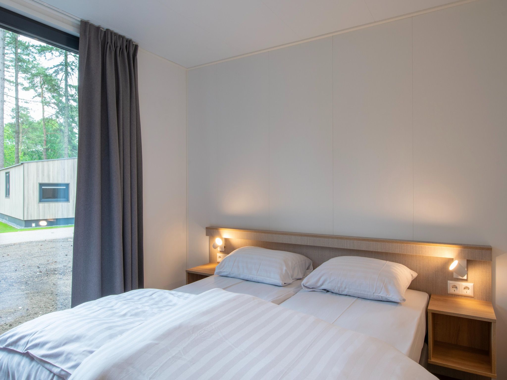 Een slaapkamer van Bospark 't Wolfsven 21 in Mierlo