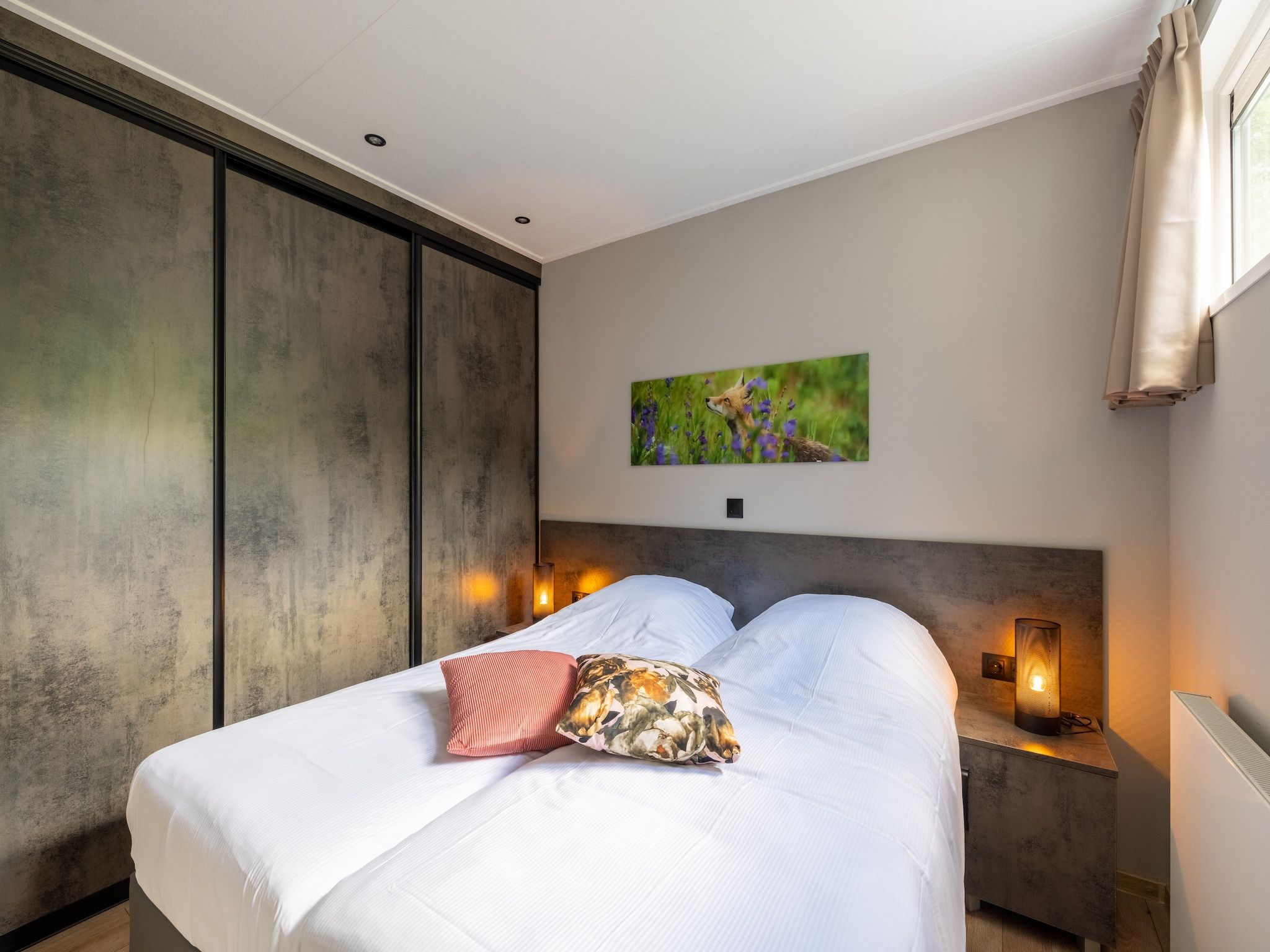 Een slaapkamer van Vakantiepark De Rimboe & De Woeste Hoogte 40 in Hoenderloo