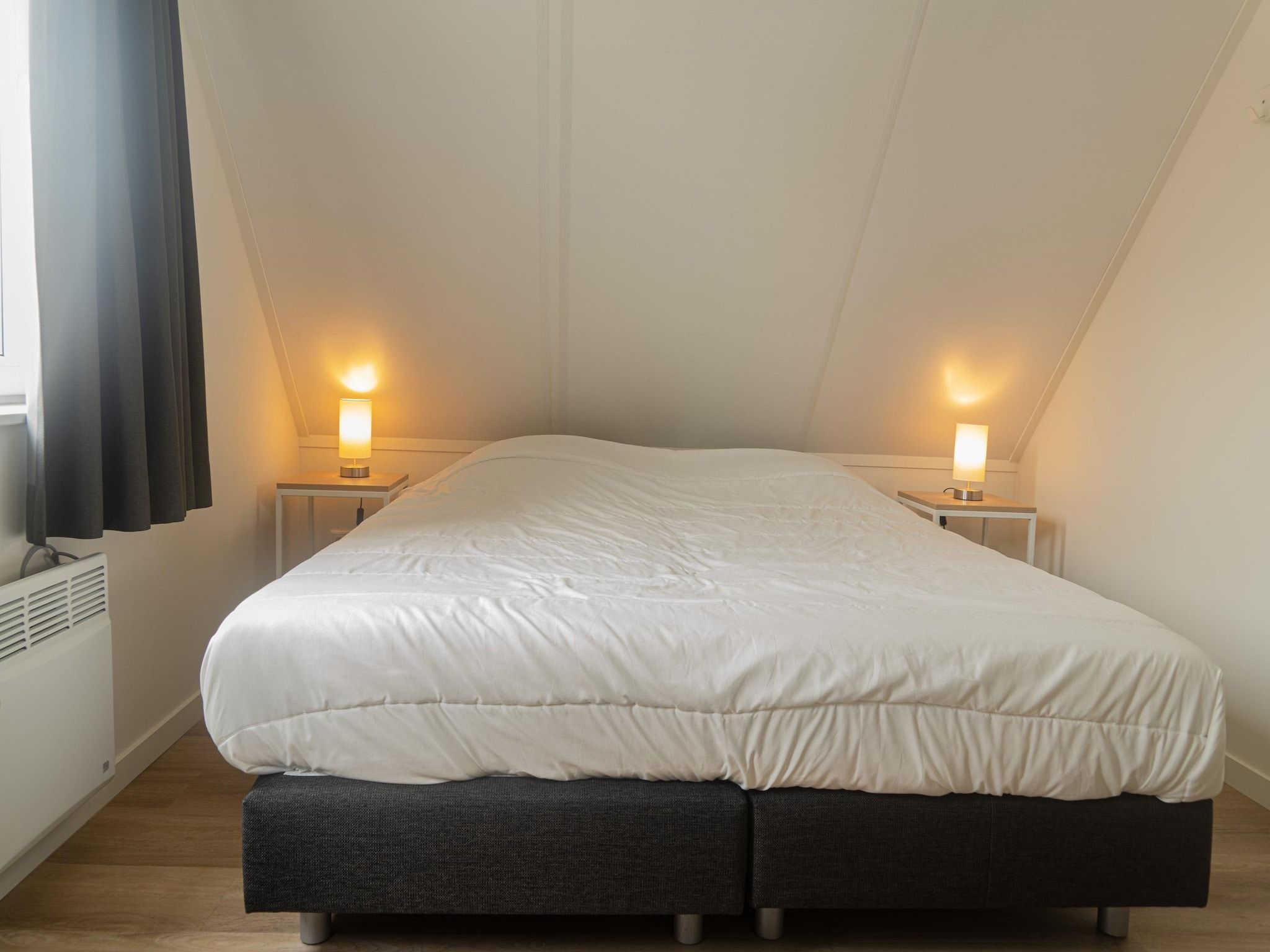 Een slaapkamer van Kuifduiker 138c in Simonshaven