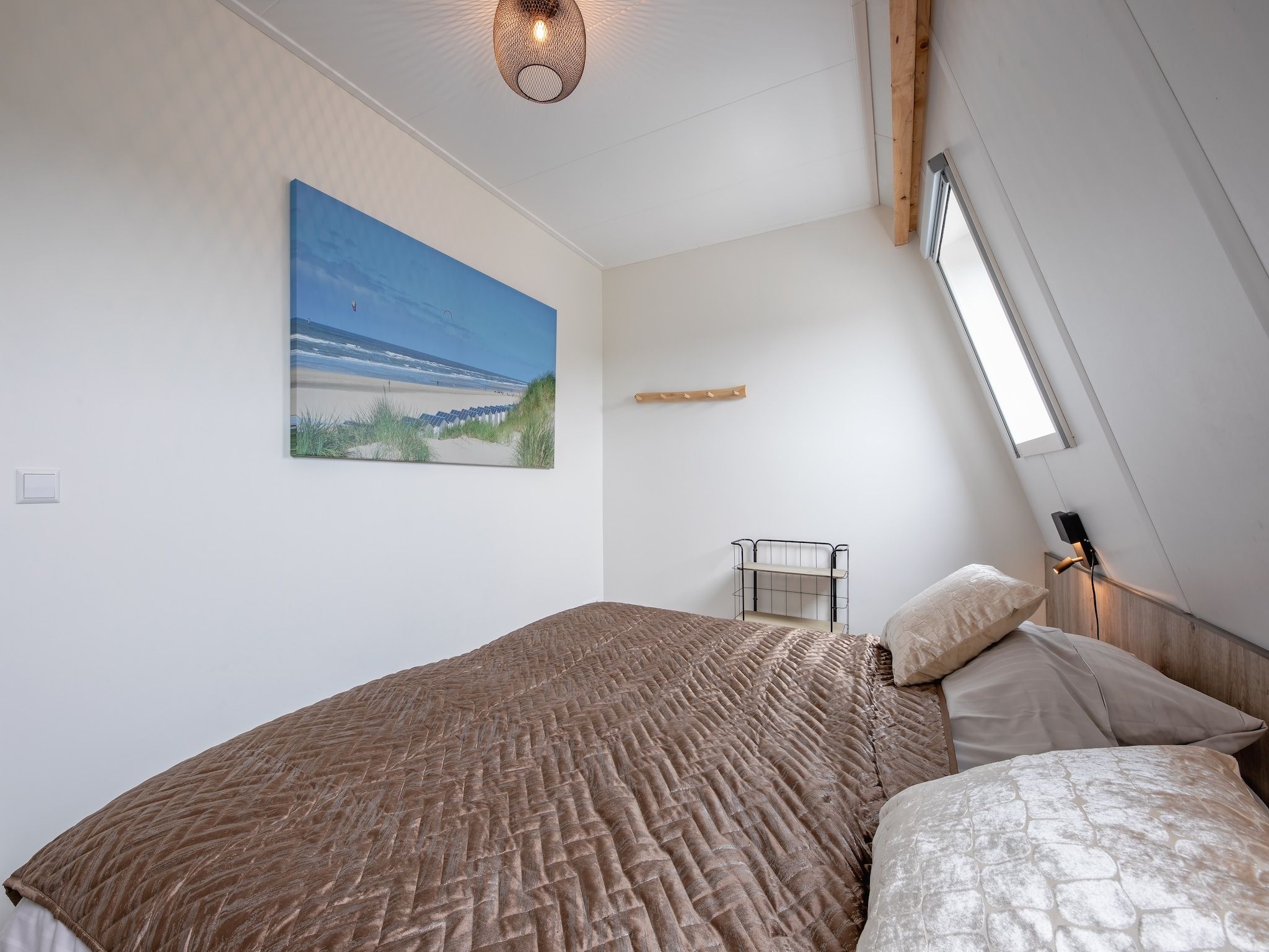 Een slaapkamer van Wulpenweid 10 in Den Burg