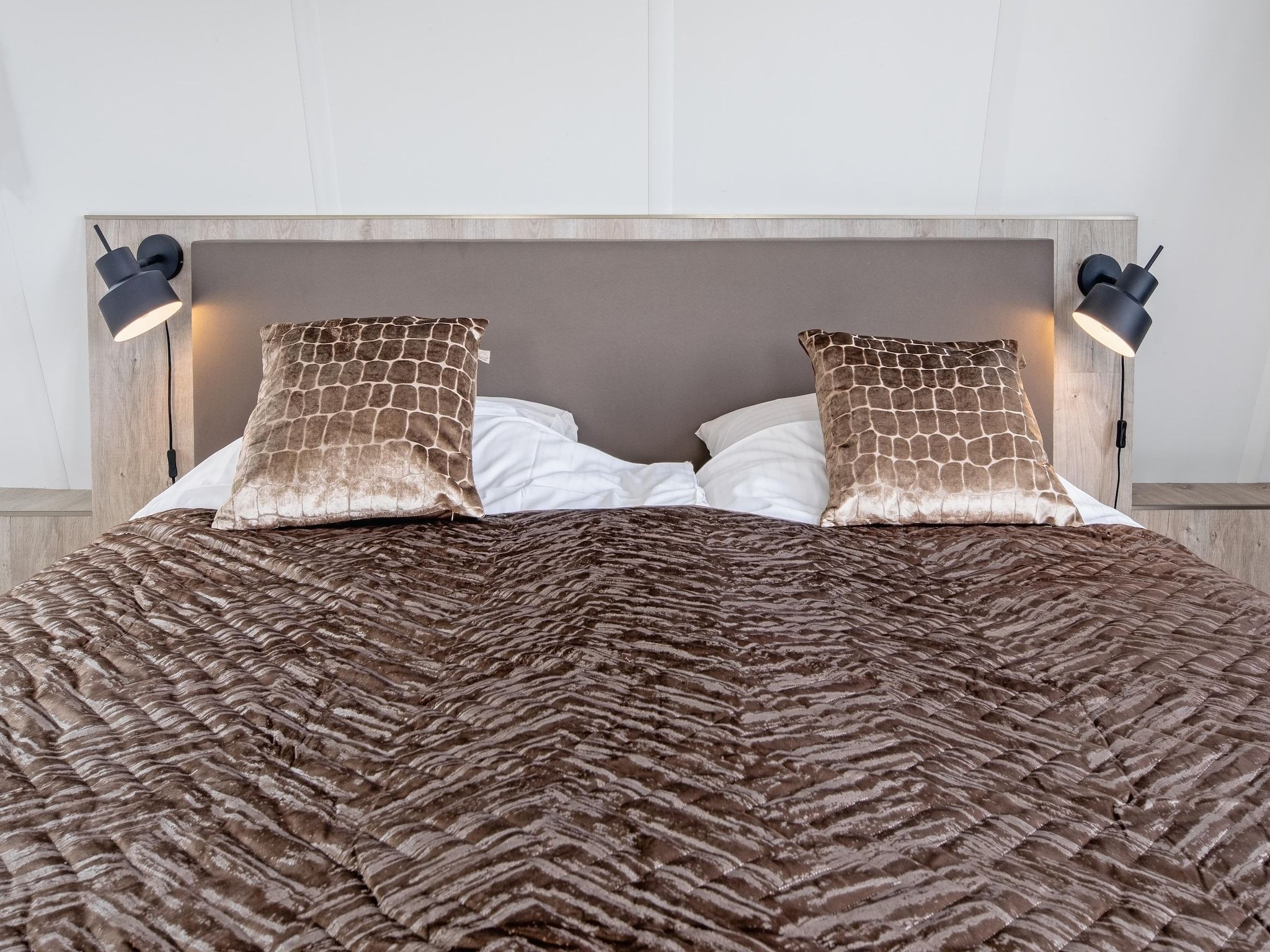 Een slaapkamer van Wulpenweid 10 in Den Burg