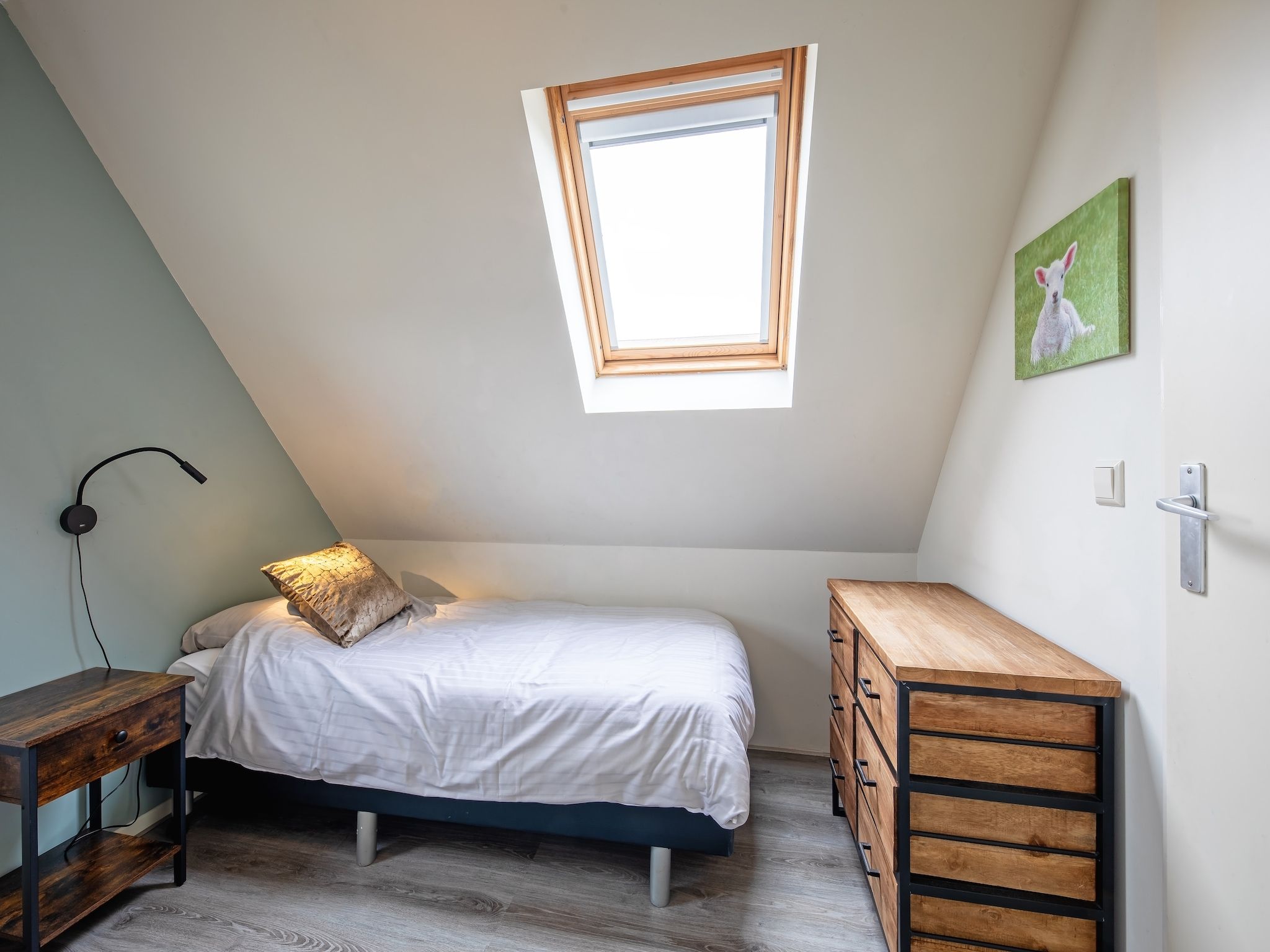 Een slaapkamer van Wulpenweid 12 in Den Burg