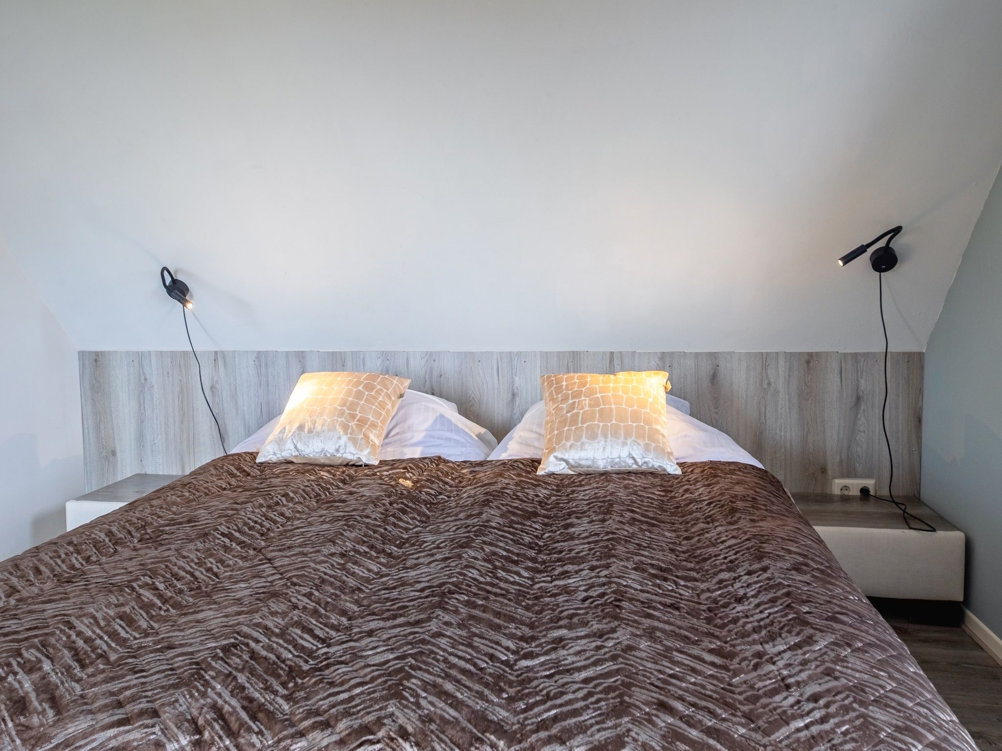 Een slaapkamer van Wulpenweid 12 in Den Burg