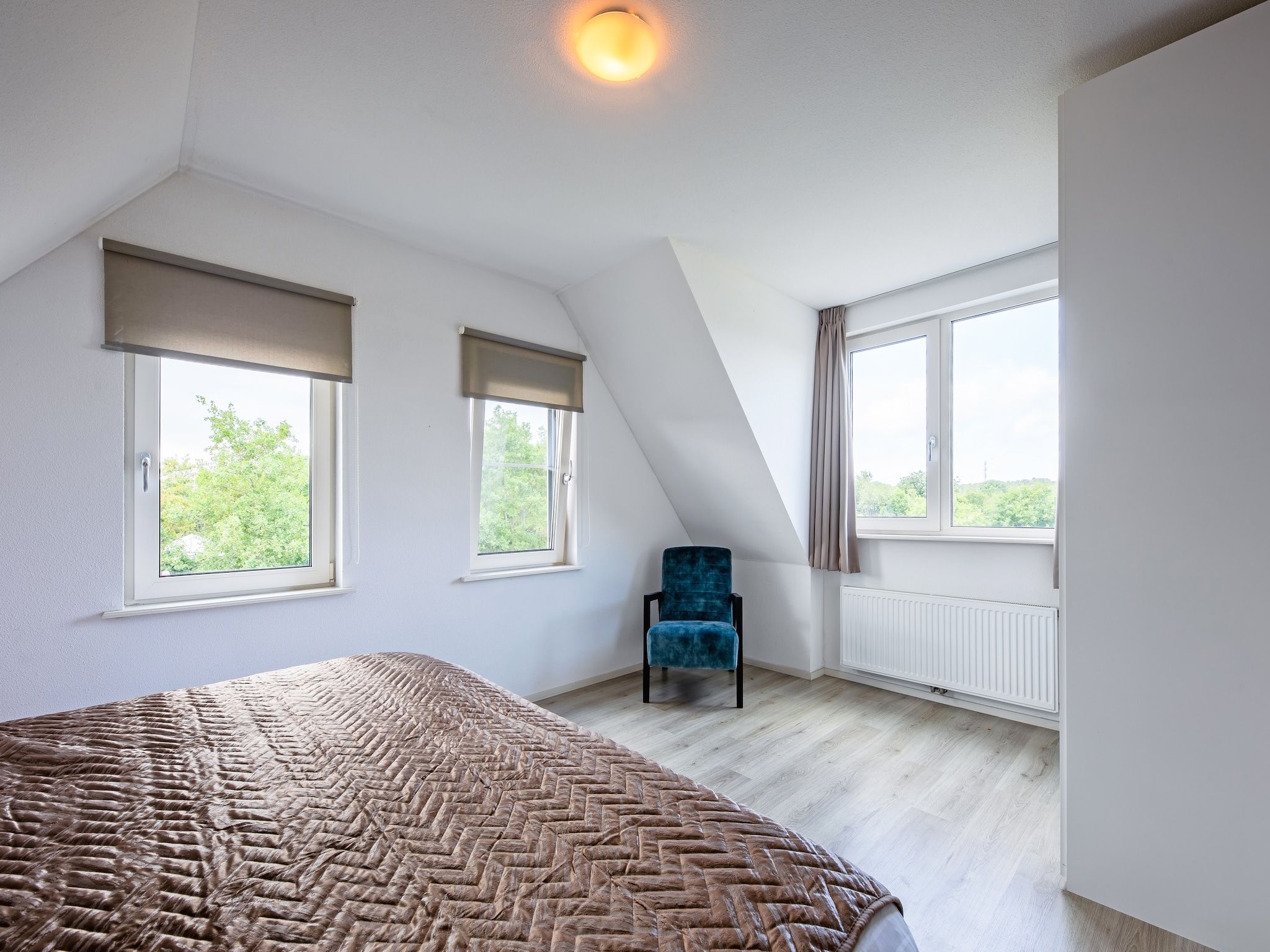 Een slaapkamer van Wulpenweid 12A in Den Burg