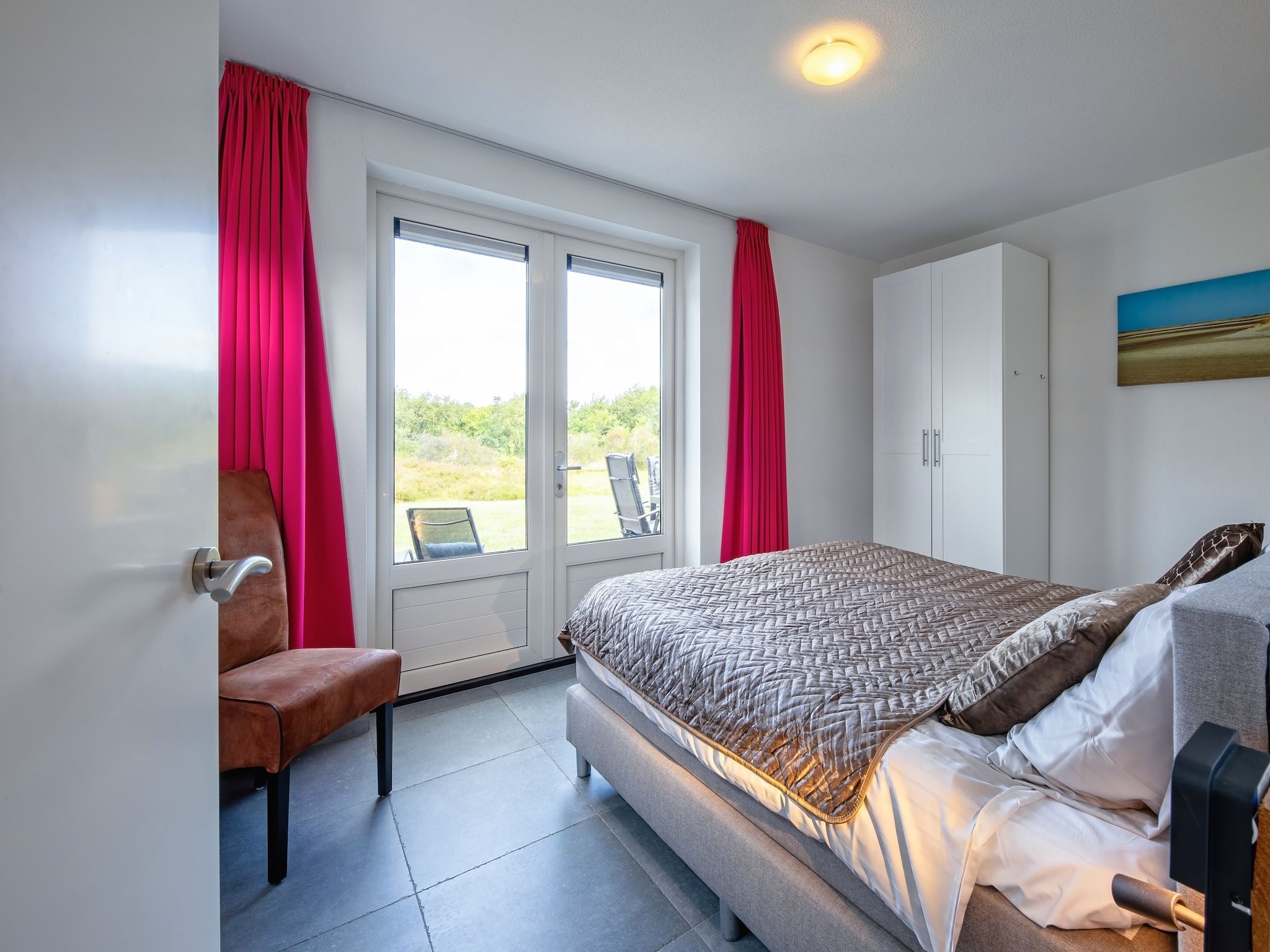 Een slaapkamer van Wulpenweid 12A in Den Burg