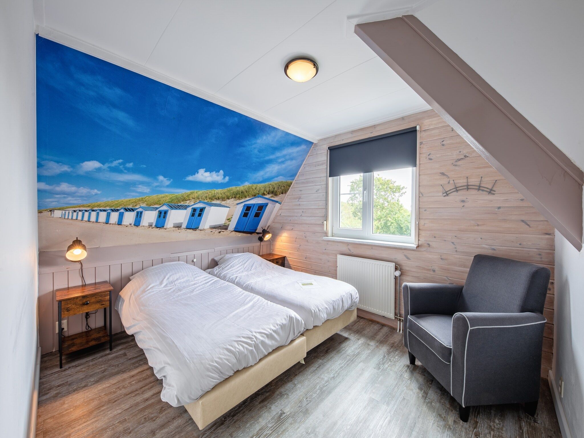 Een slaapkamer van Wulpenweid 14 in Den Burg