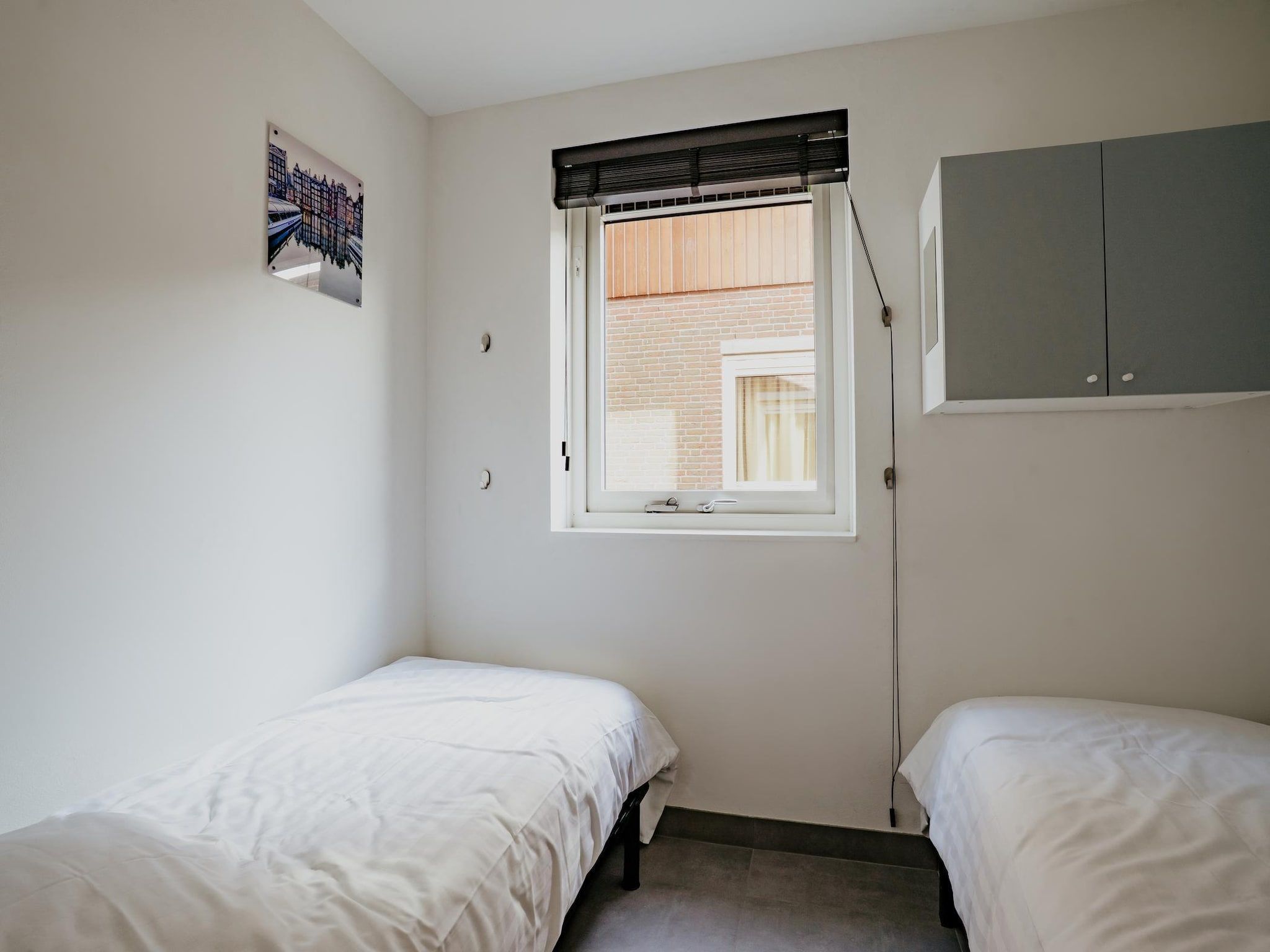 Een slaapkamer van Waterpark de Meerparel 13 in Uitgeest