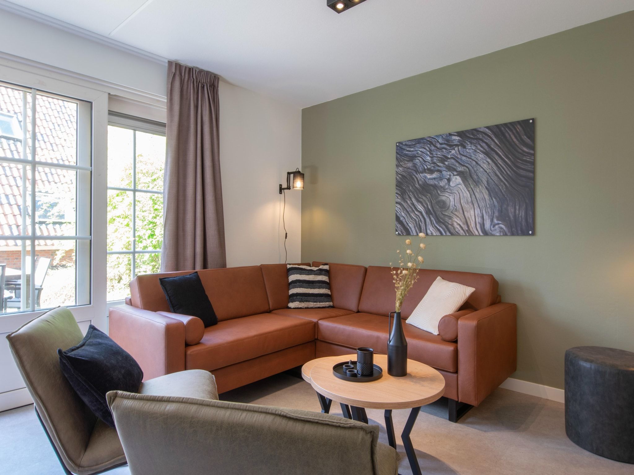 De woonkamer van Vakantiepark de Katjeskelder 24 in Oosterhout