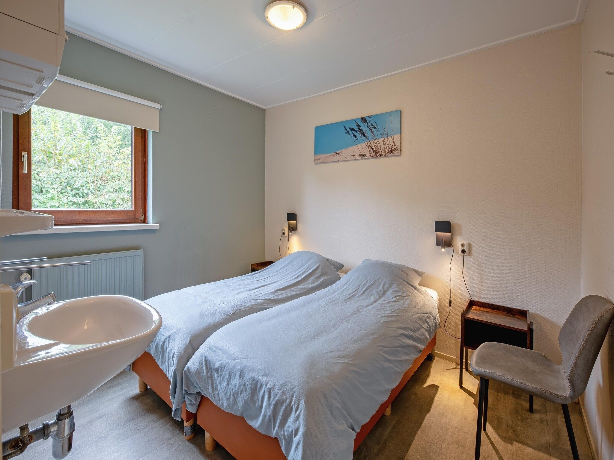 Een slaapkamer van De Parel 166 in Den Burg