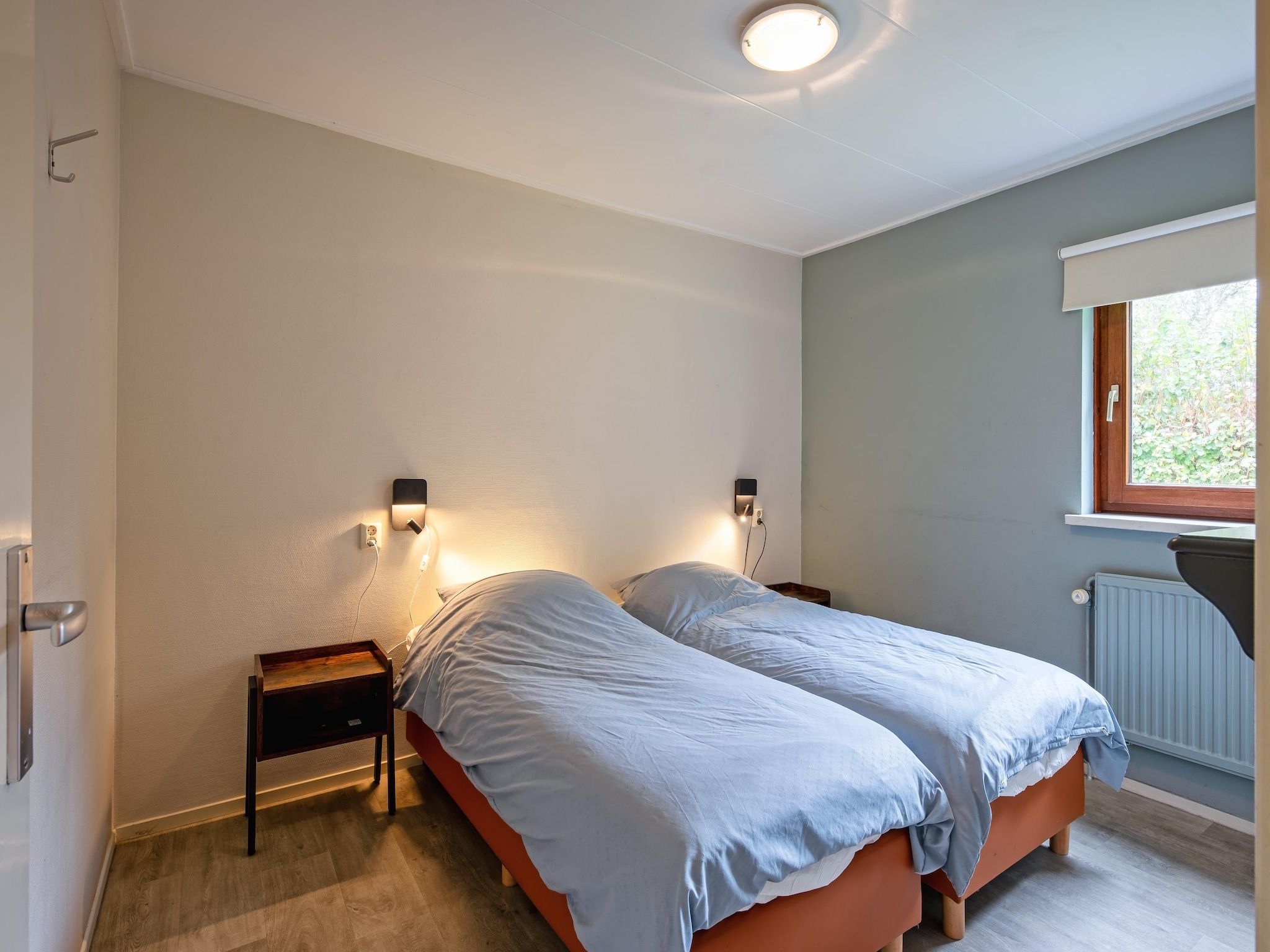 Een slaapkamer van De Parel 166 in Den Burg