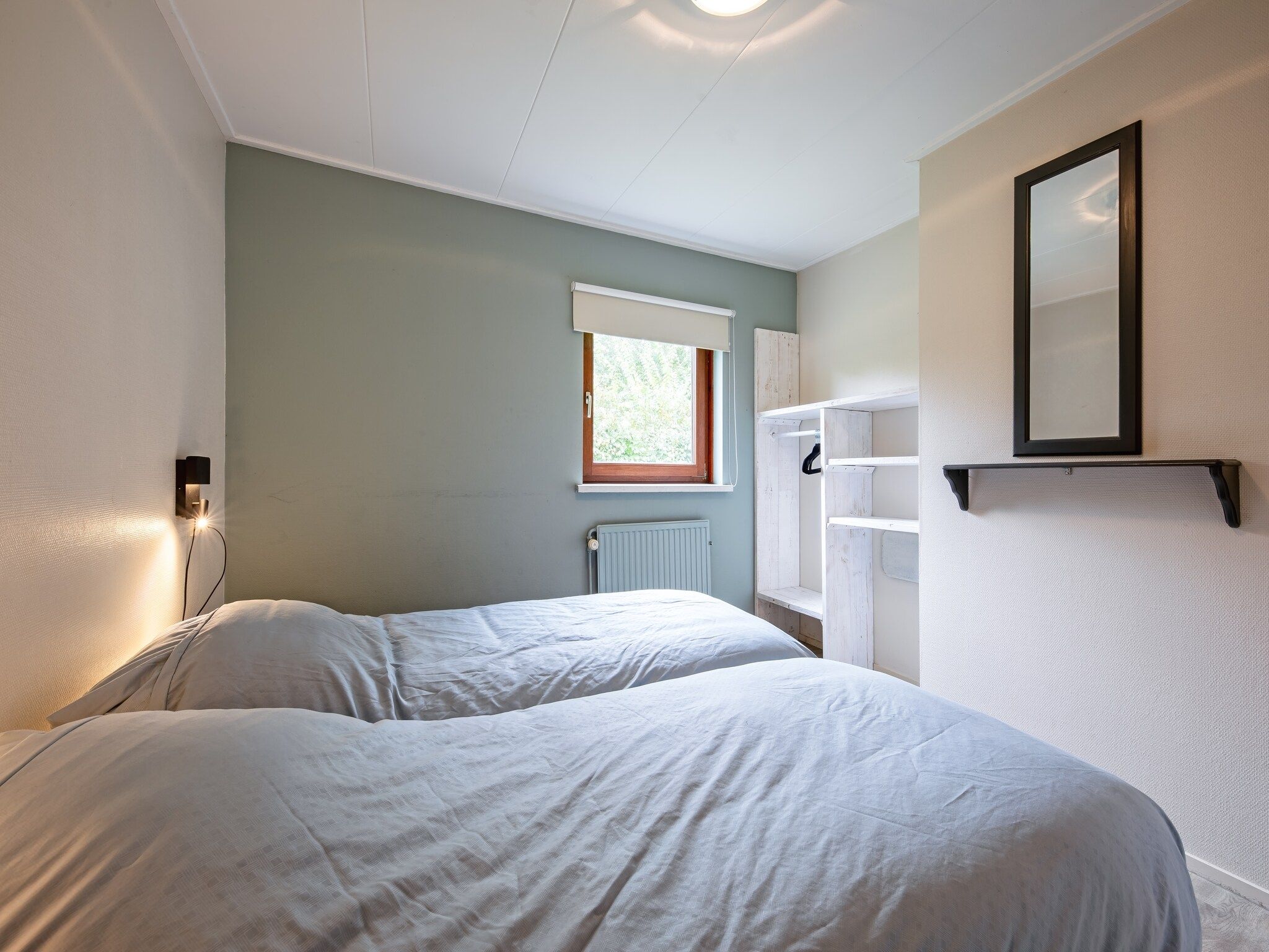 Een slaapkamer van De Parel 166 in Den Burg