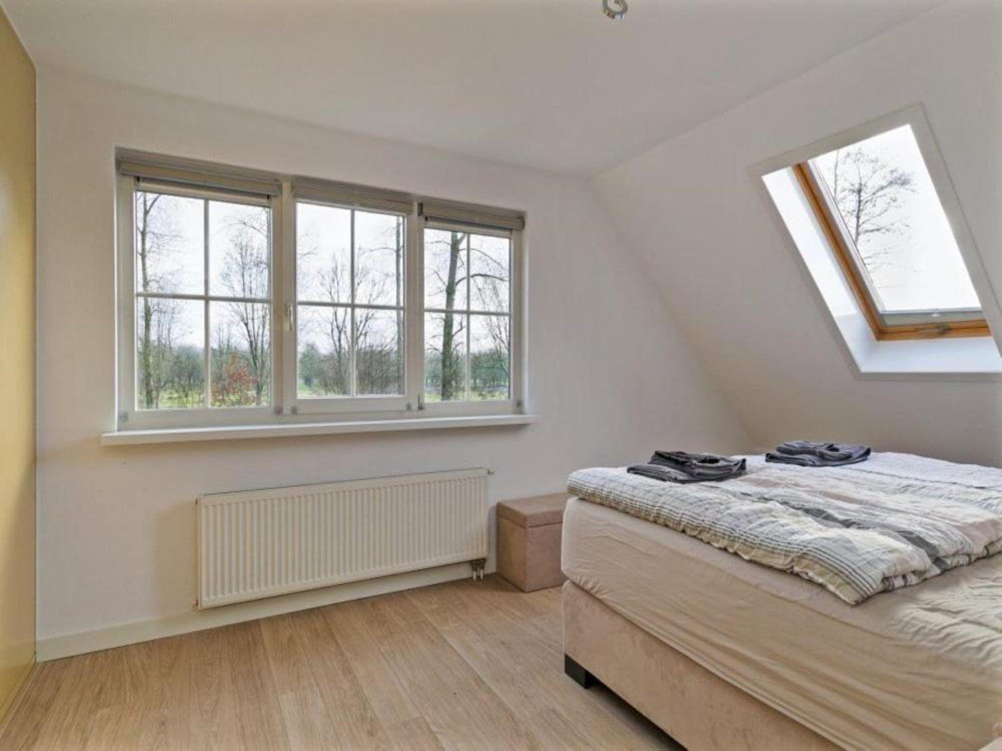 Een slaapkamer van Villa Bosrijk in Zeewolde