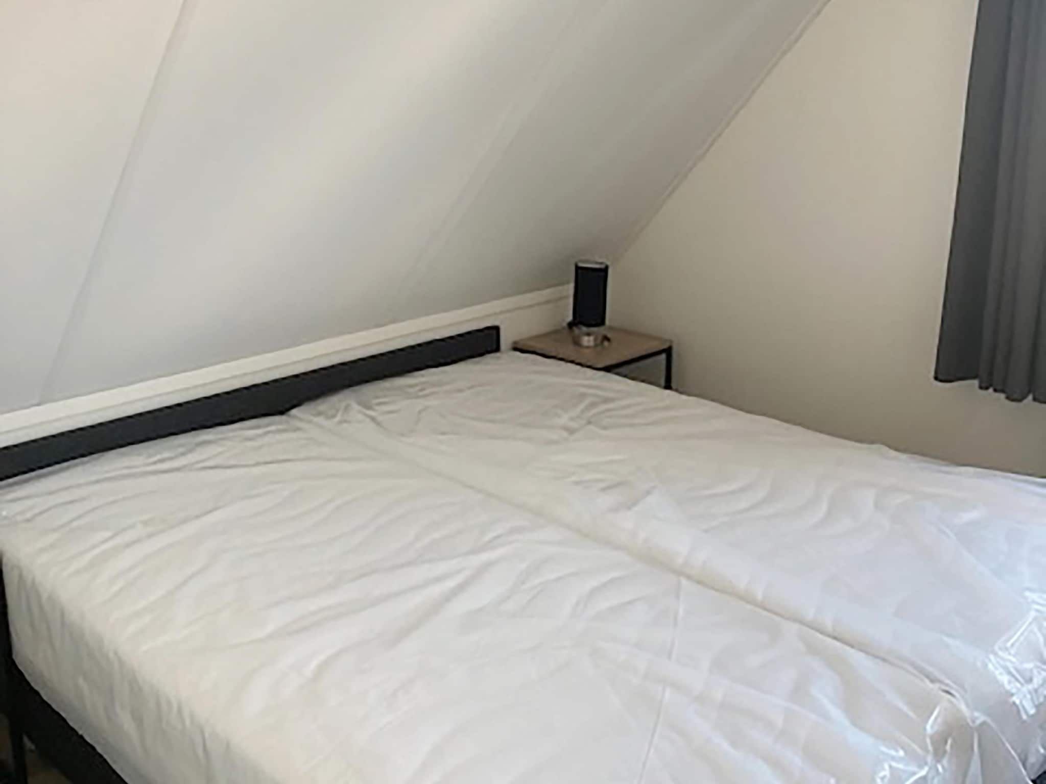 Een slaapkamer van Kuifduiker 124 in Simonshaven