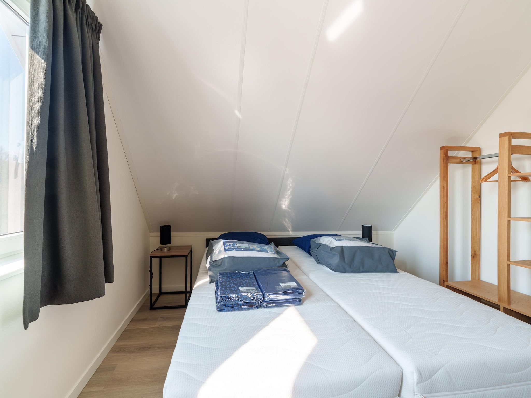 Een slaapkamer van Kuifduiker 124 in Simonshaven