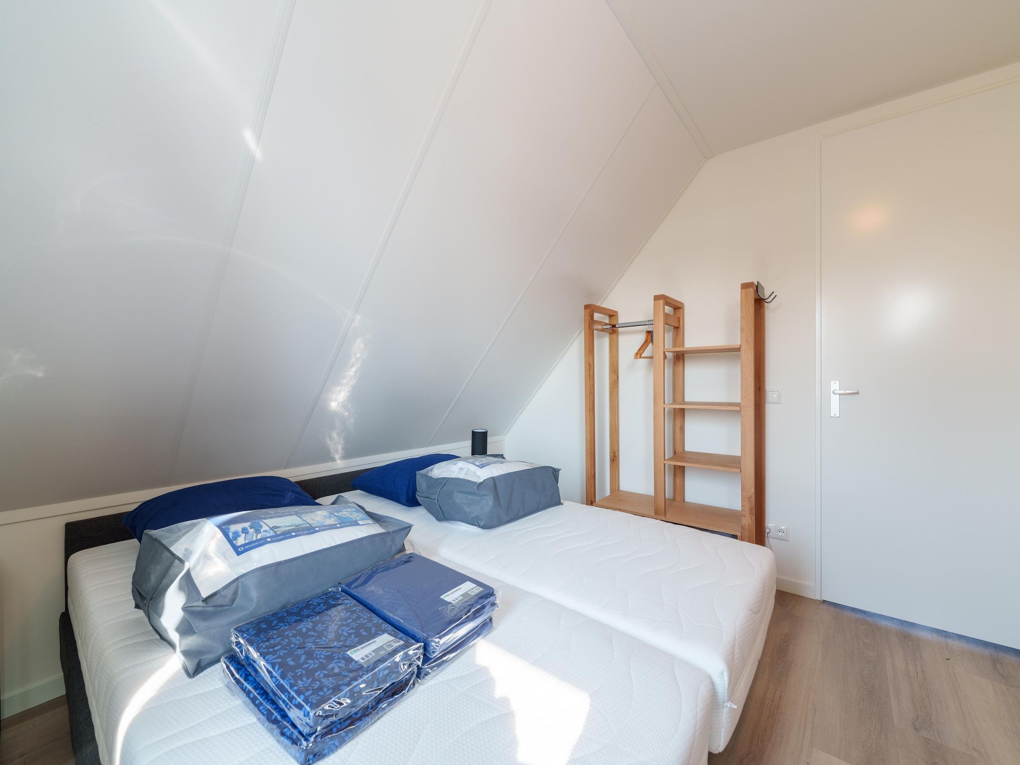 Een slaapkamer van Kuifduiker 124 in Simonshaven