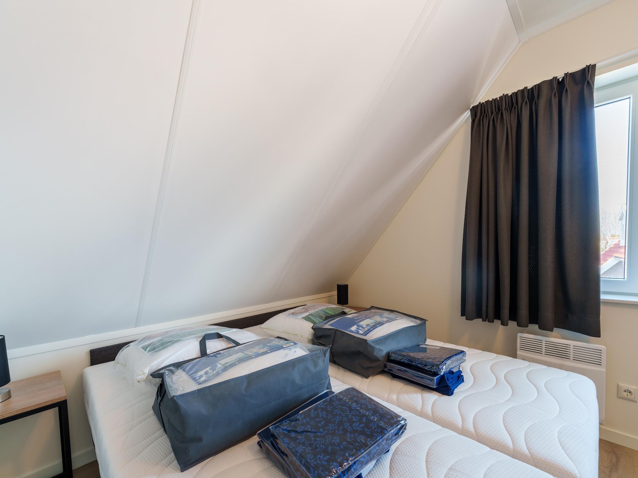 Een slaapkamer van Kuifduiker 124 in Simonshaven