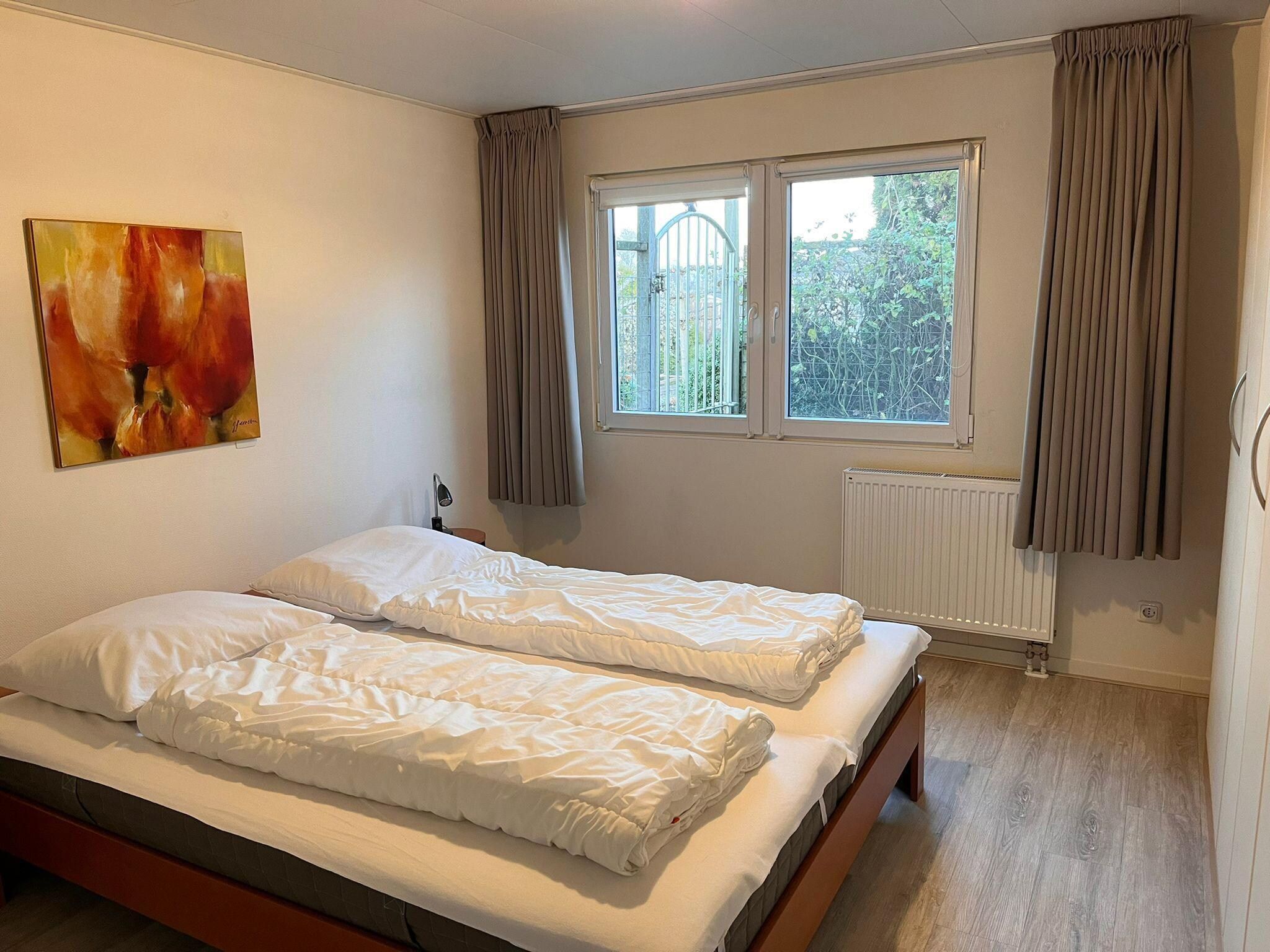 Een slaapkamer van Fijne bungalow in Makkum in Friesland