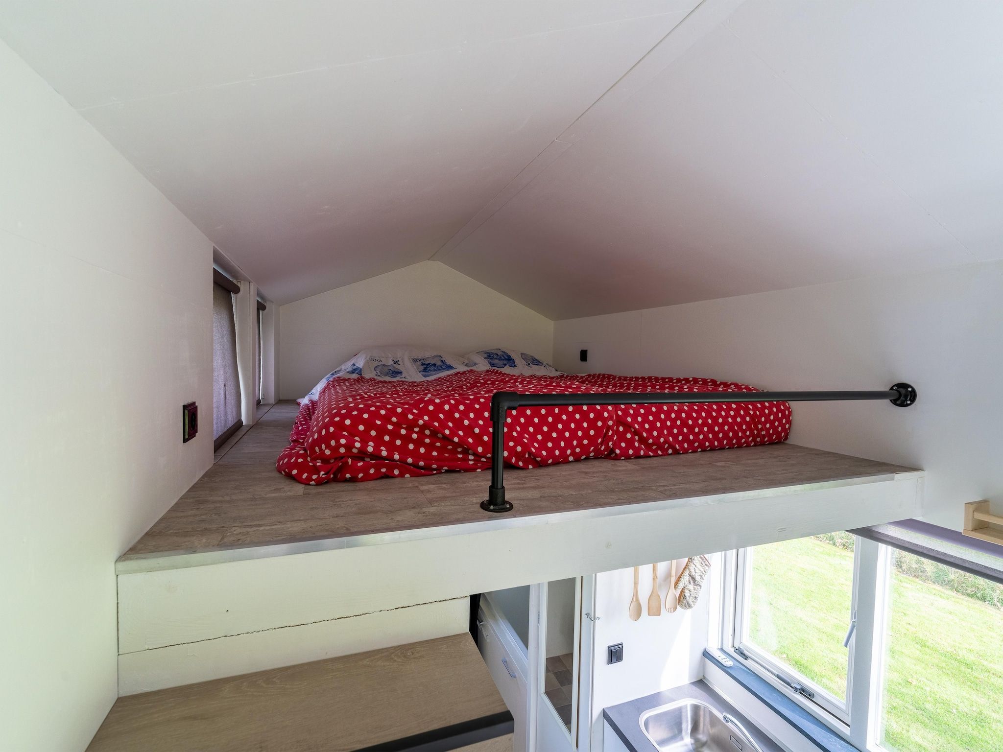 Een slaapkamer van Tiny House in Burgerbrug