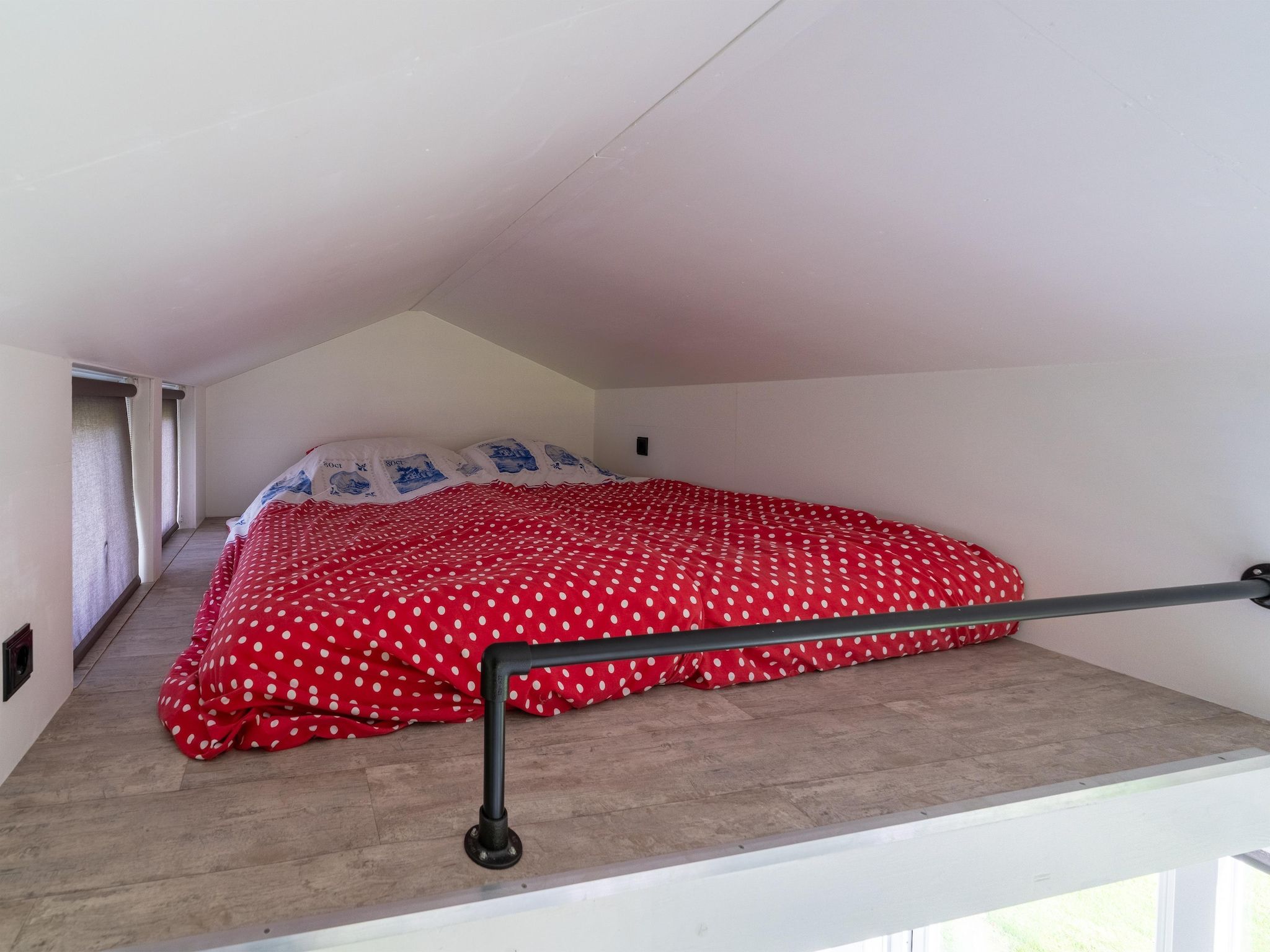 Een slaapkamer van Tiny House in Burgerbrug