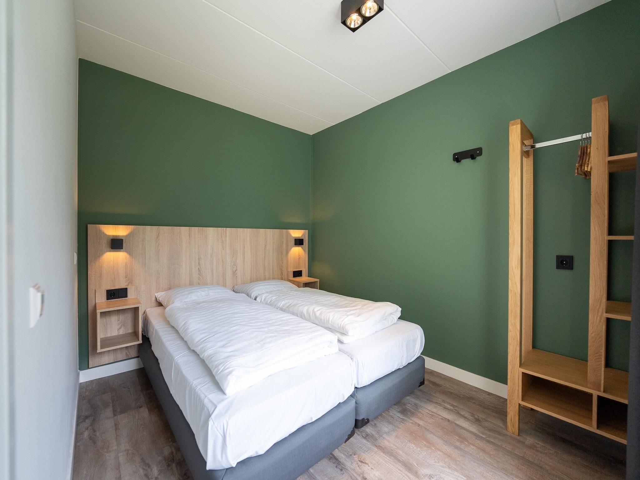 Een slaapkamer van Vakantiepark Hunzedal 19 in Borger