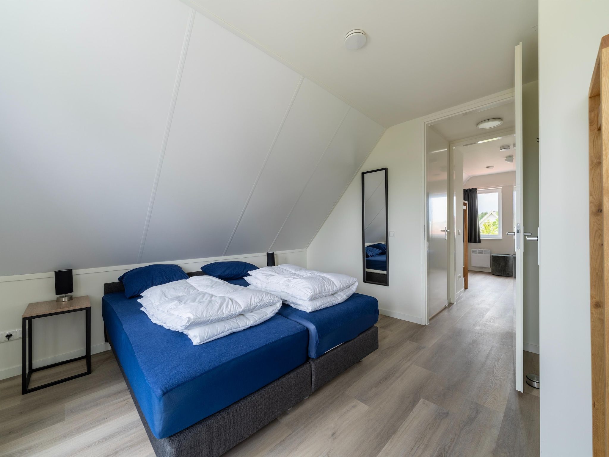 Een slaapkamer van Strandloper 129 in Simonshaven