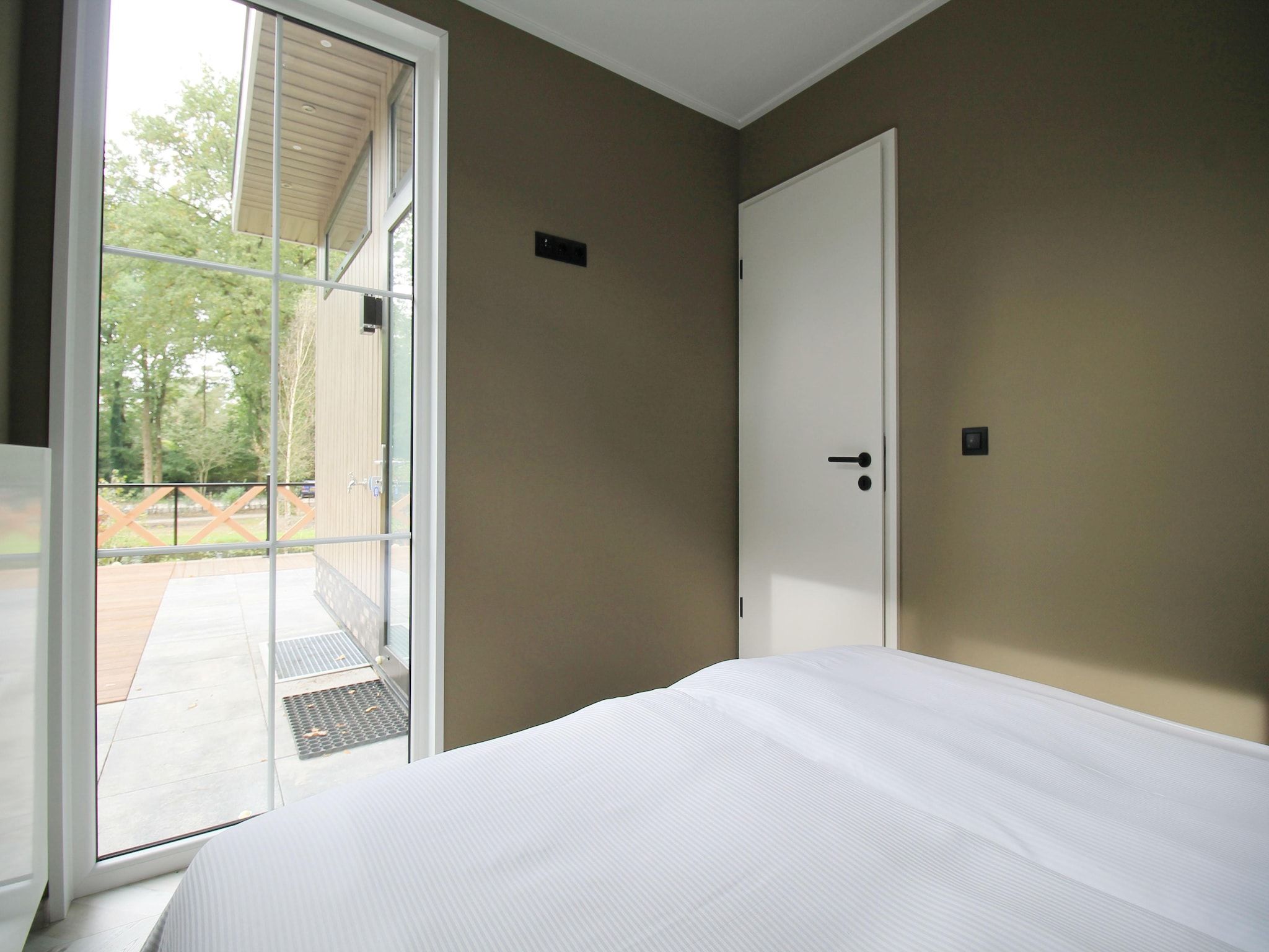 Een slaapkamer van Vakantiepark De Rimboe & De Woeste Hoogte 42 in Hoenderloo