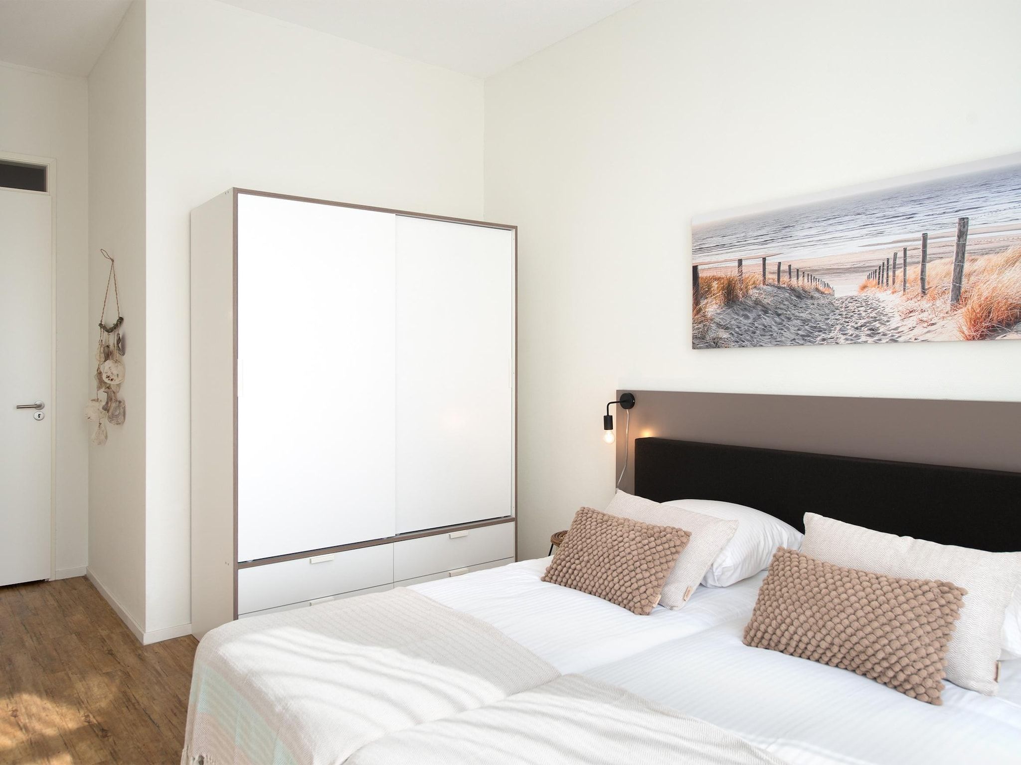 Een slaapkamer van Scheveningen Harbour 56A in Den Haag