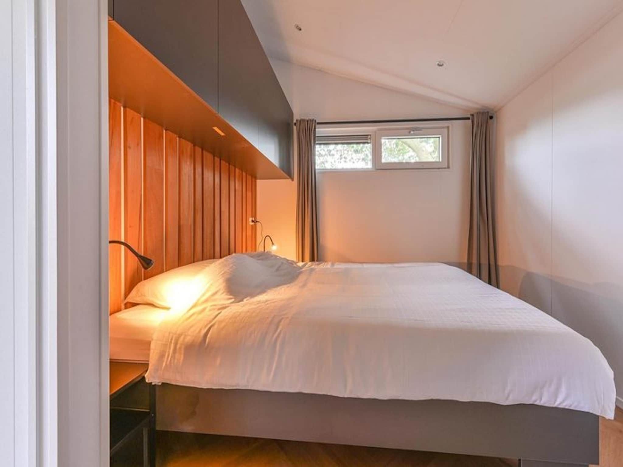 Een slaapkamer van Resort Drentse Weelde 1 in Hoogersmilde