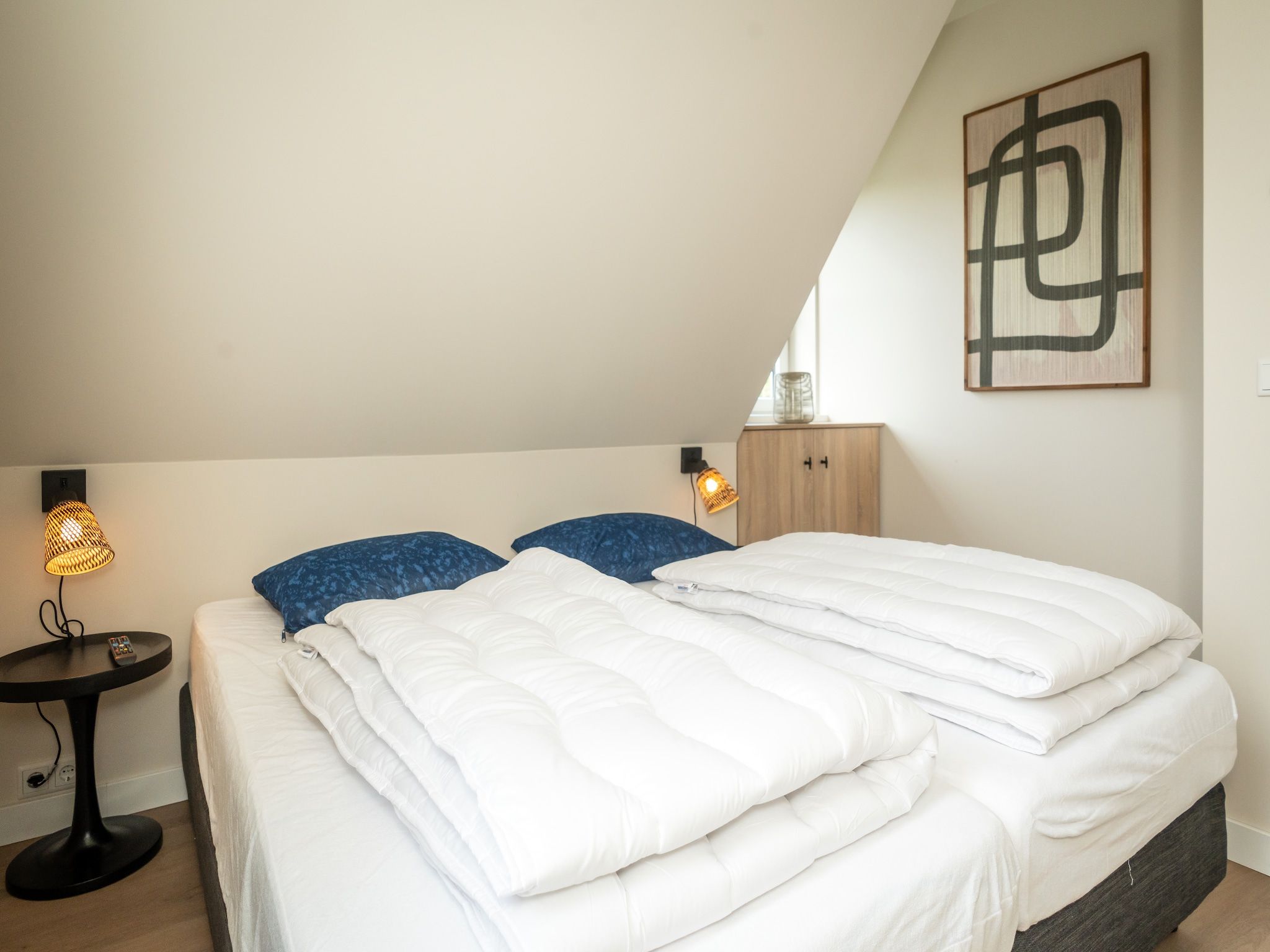 Een slaapkamer van So What 25a in De Koog