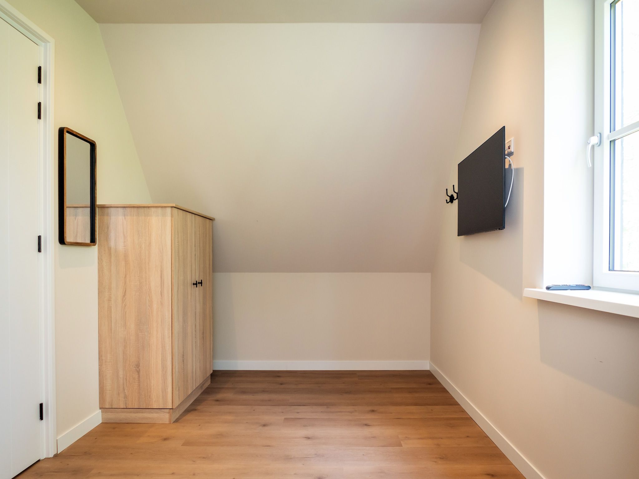 Een slaapkamer van So What 33A in De Koog