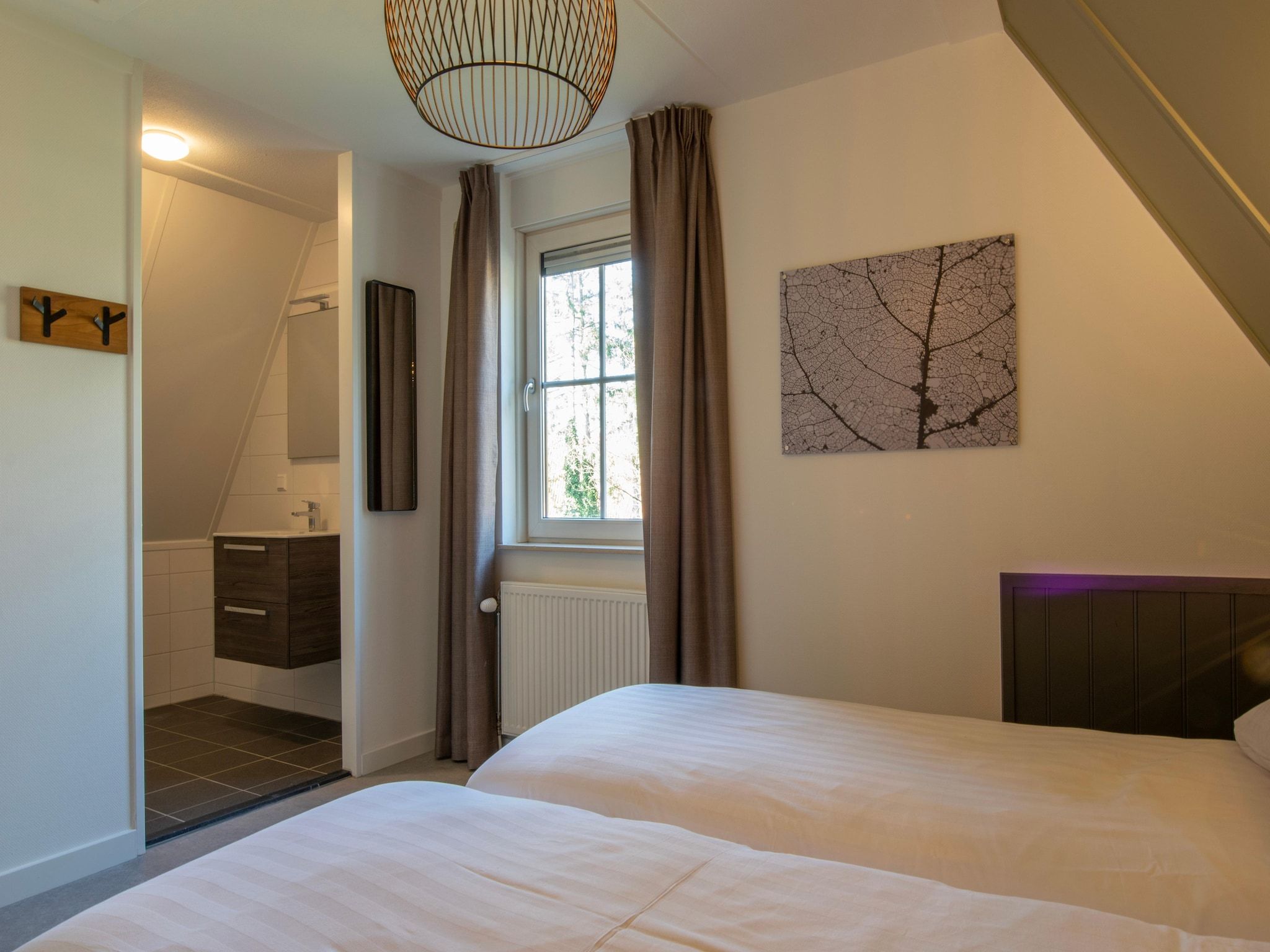 Een slaapkamer van Vakantiepark de Katjeskelder 25 in Oosterhout