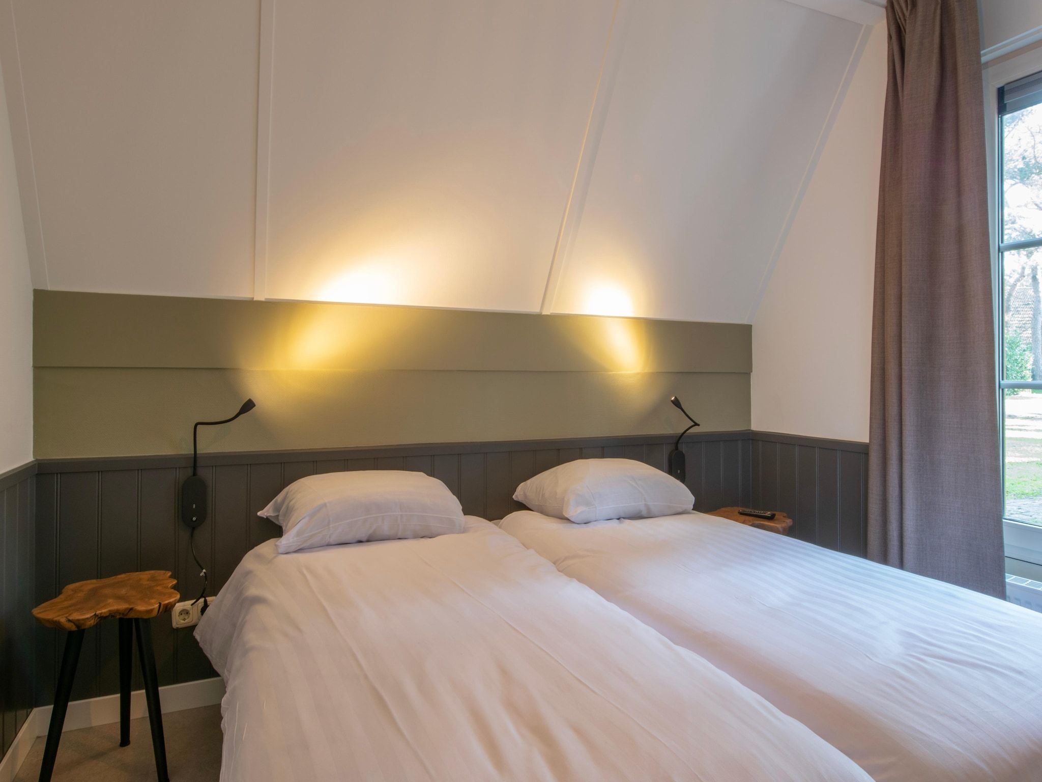 Een slaapkamer van Vakantiepark de Katjeskelder 25 in Oosterhout