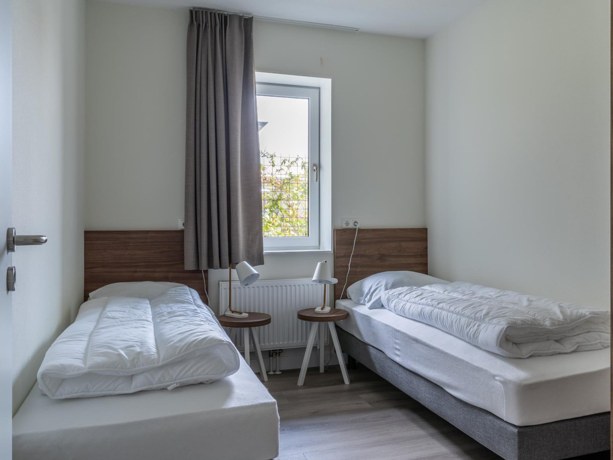 Een slaapkamer van Appartement - Paviljoenwei 4  Sneek Offingawier 'Havenzicht' in Sneek