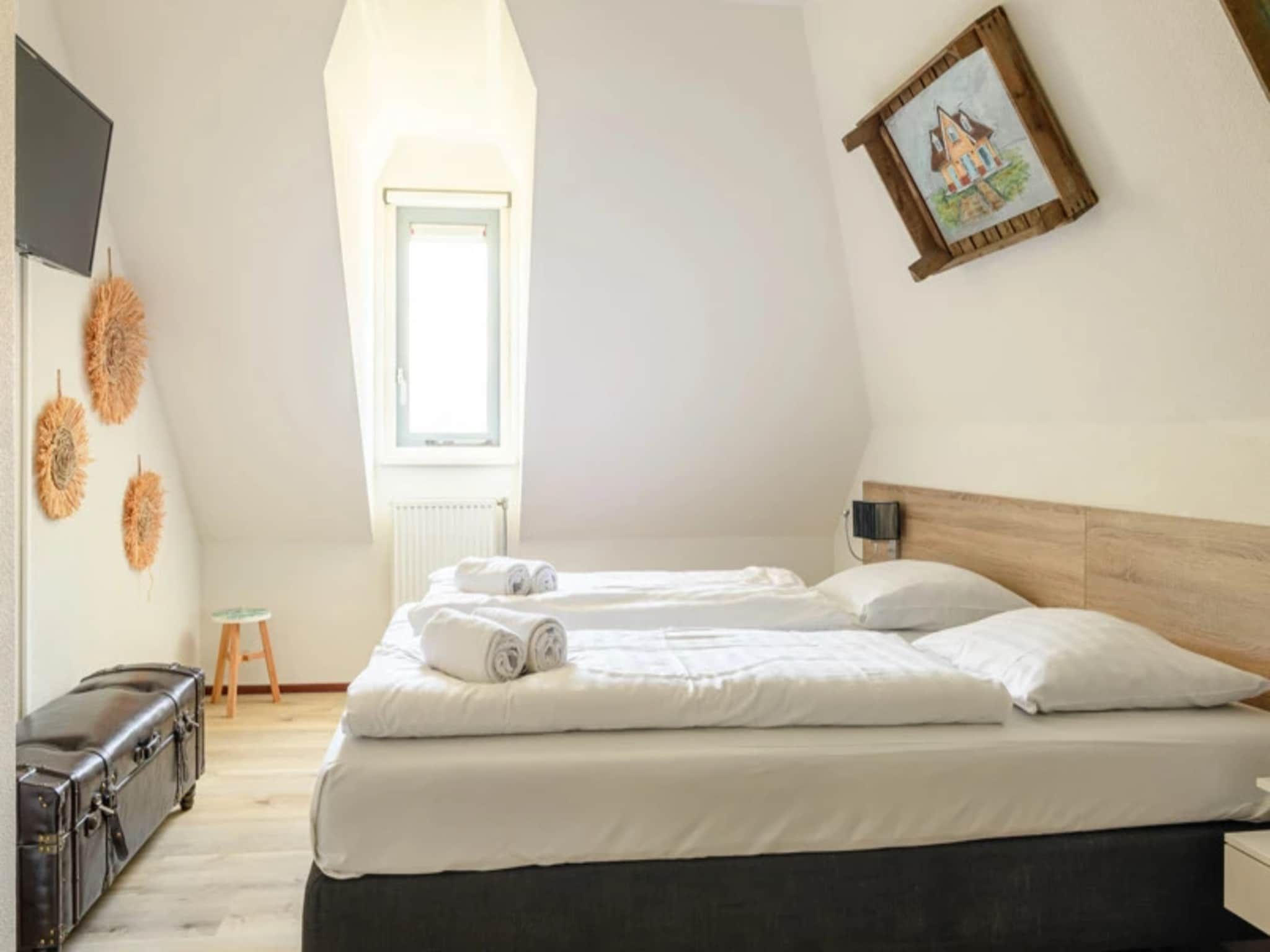 Een slaapkamer van Vakantiepark Duynzicht 3 in Julianadorp aan zee