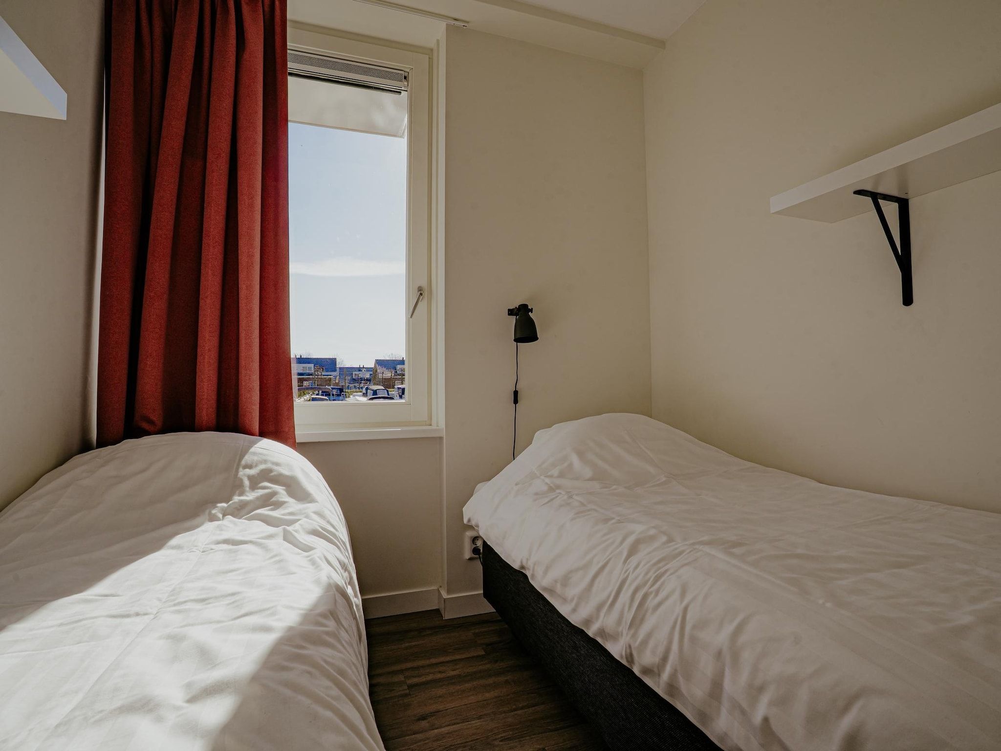 Een slaapkamer van Waterpark de Meerparel 14 in Uitgeest