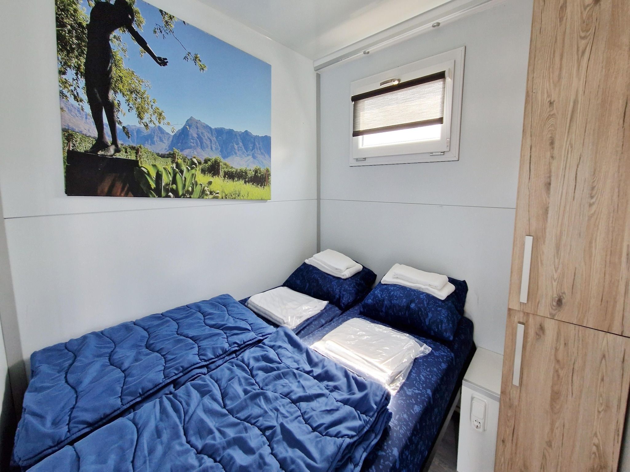 Een slaapkamer van Havenlodges Naarden 1 in Naarden